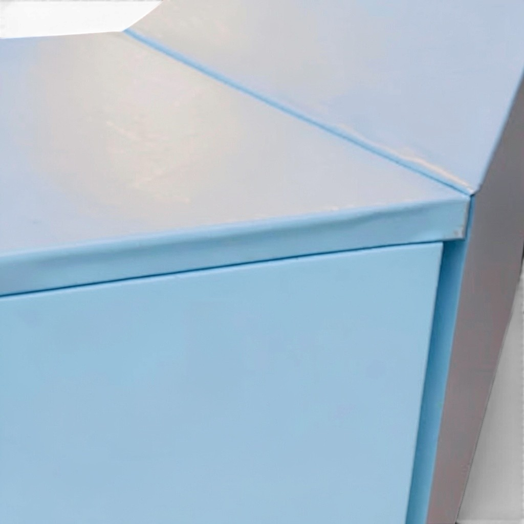 UK Gym Pits light blue PVC foam padding installed on a gymnastics landing pit wall and top edge for shock absorption.