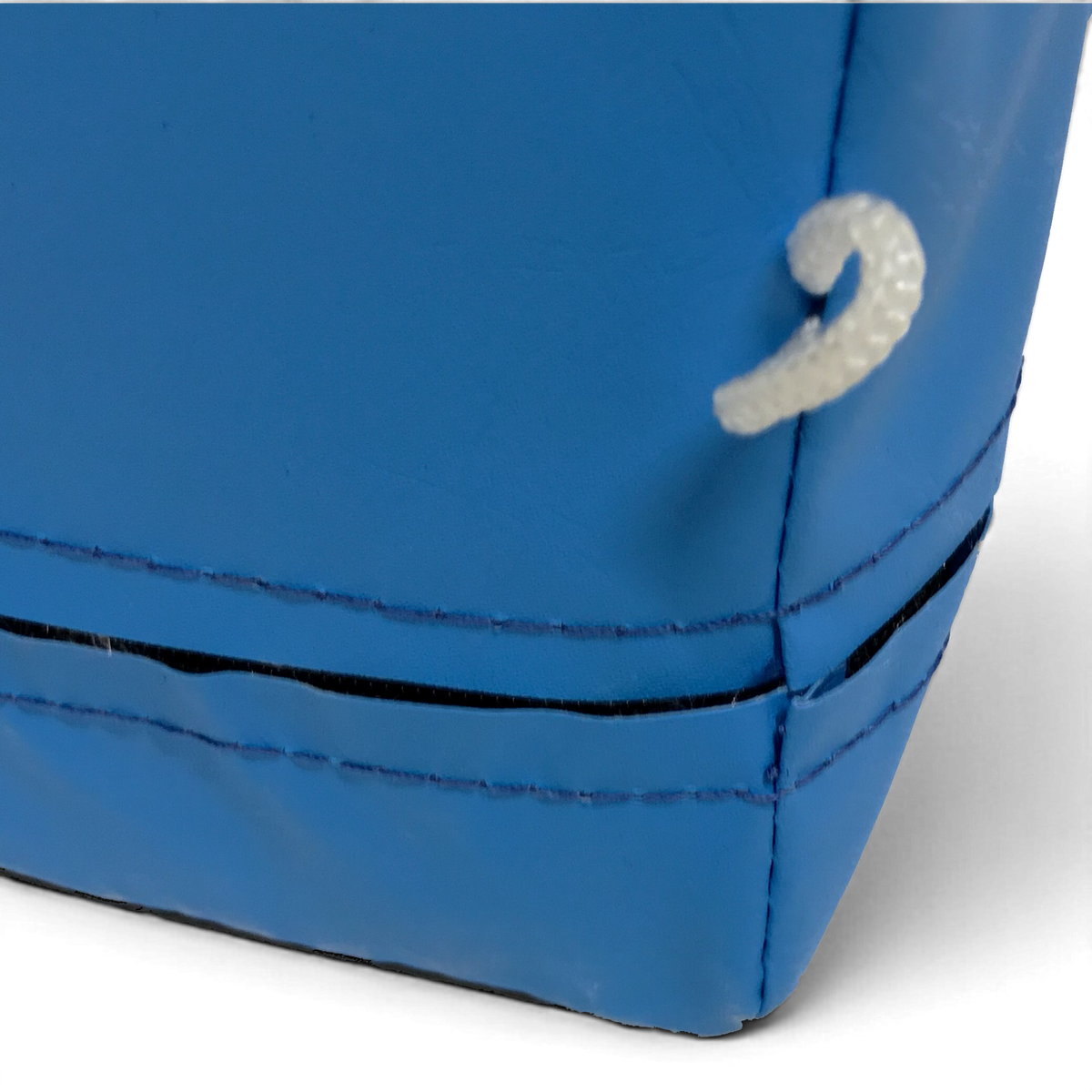 UK Gym Pits blue parkour landing mat corner detail showing durable PVC material and integrated attachment toggle