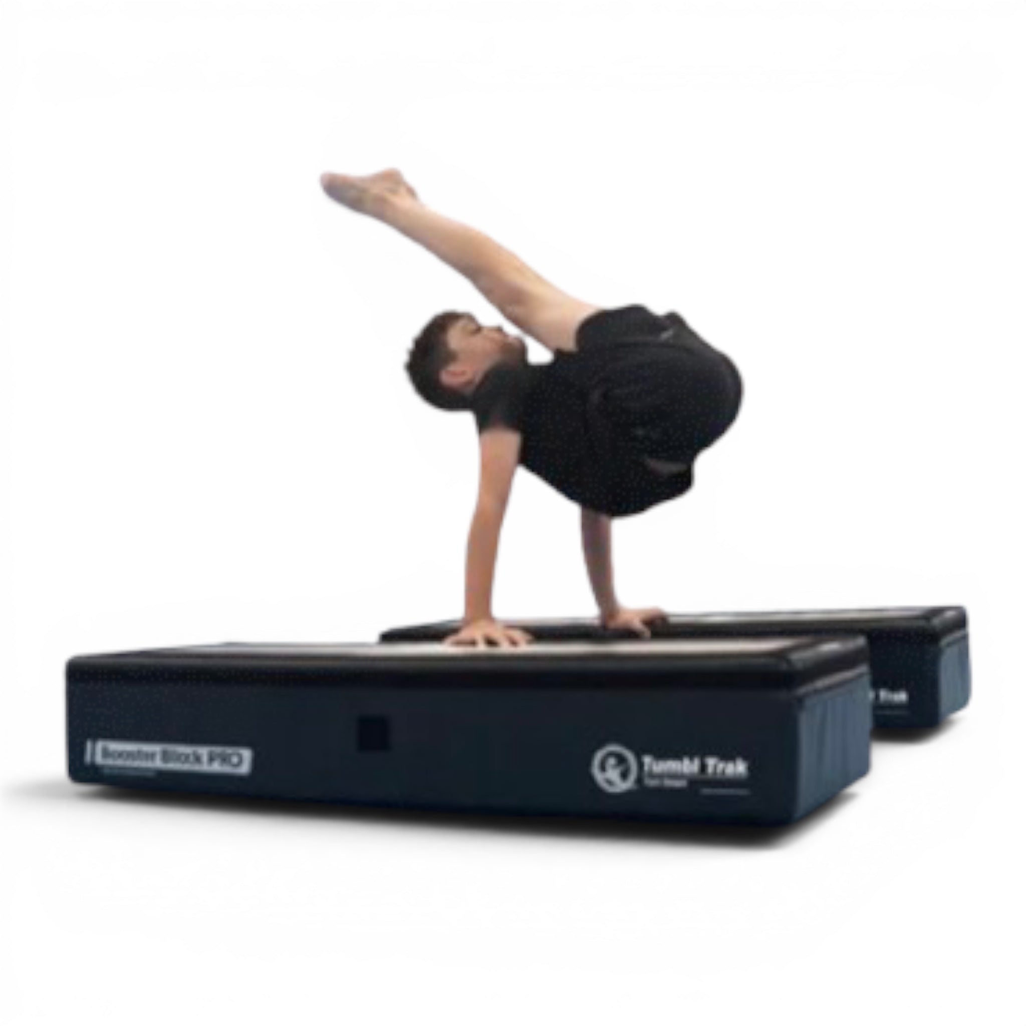 Young gymnast performing a handstand on a black UK Gym Pits Booster Block Pro with a white centre alignment line.