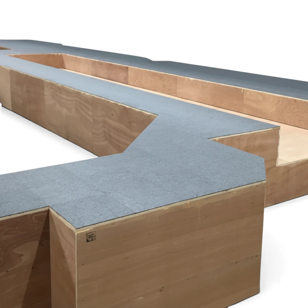 UK Gym Pits carpet tiles installed on a wooden gym structure using professional tackifier adhesive