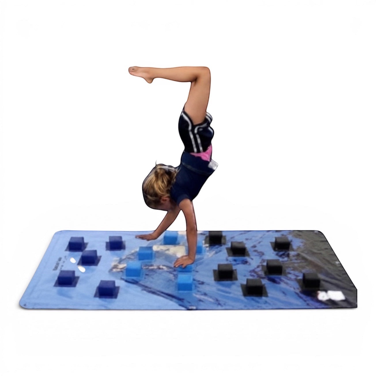 UK Gym Pits carpet wall overlay with blue surface and attached foam blocks, used by a child practicing a handstand.