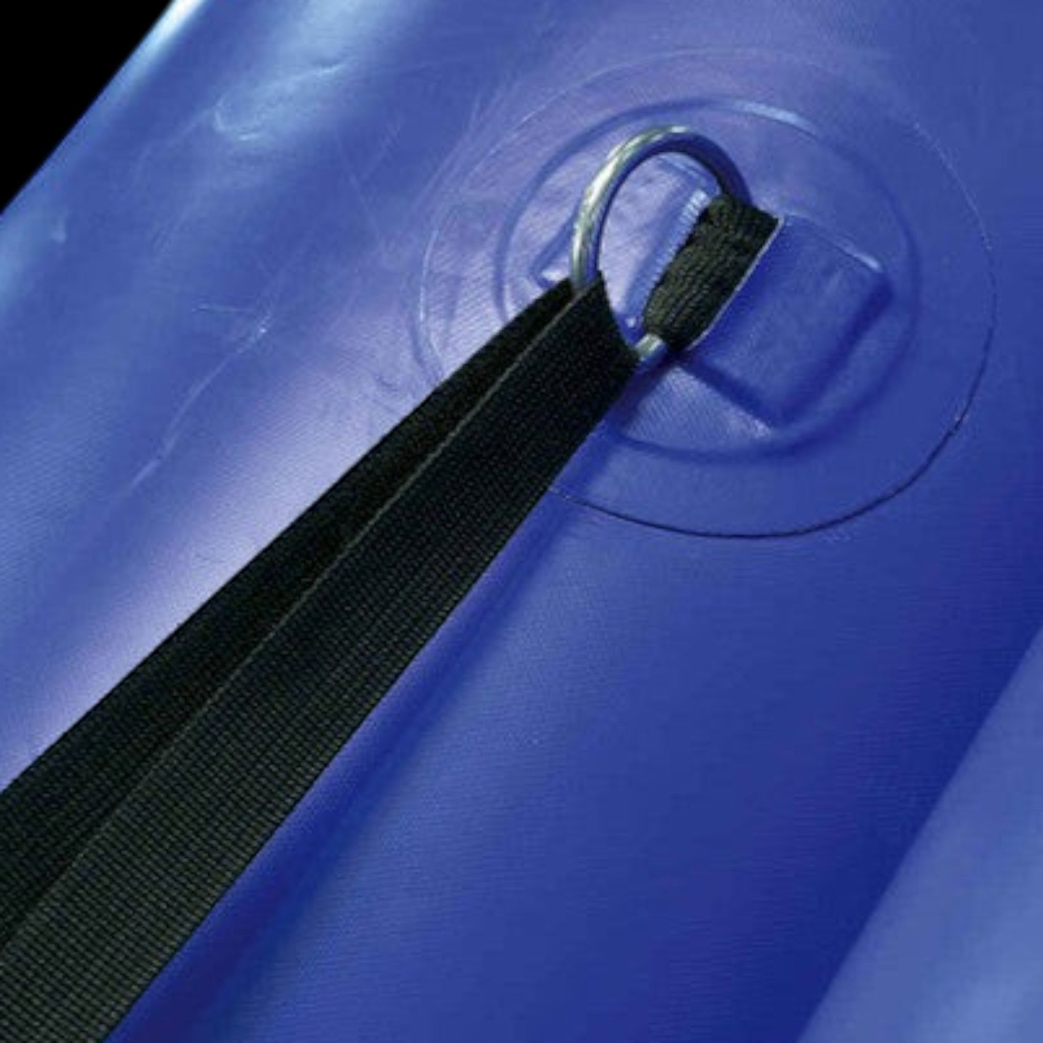 UK Gym Pits black webbing cinch strap with metal D-ring attached to a blue roll-out gym floor mat