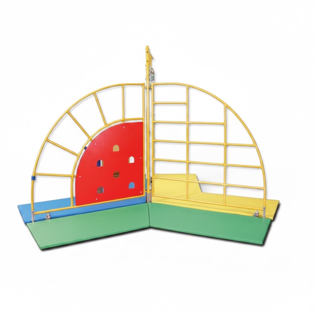 UK Gym Pits children's climbing frame with yellow steel structure, red climbing wall, and multi-colored safety mats.