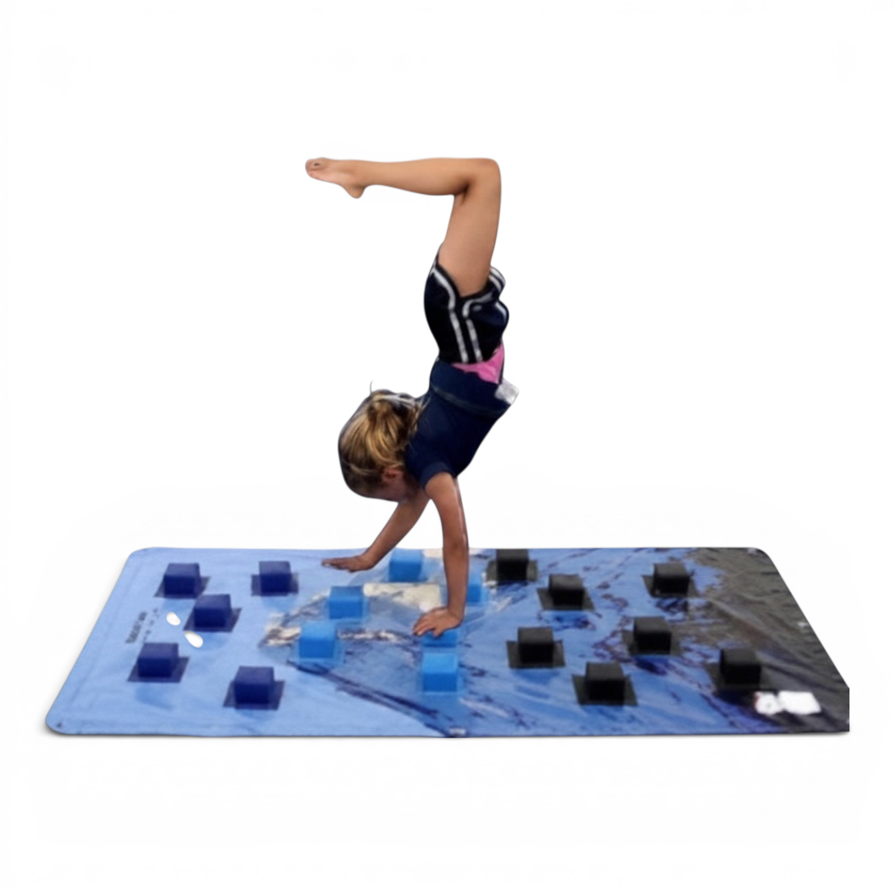 UK Gym Pits climbing wall overlay with blue and black foam blocks being used by a child doing a handstand