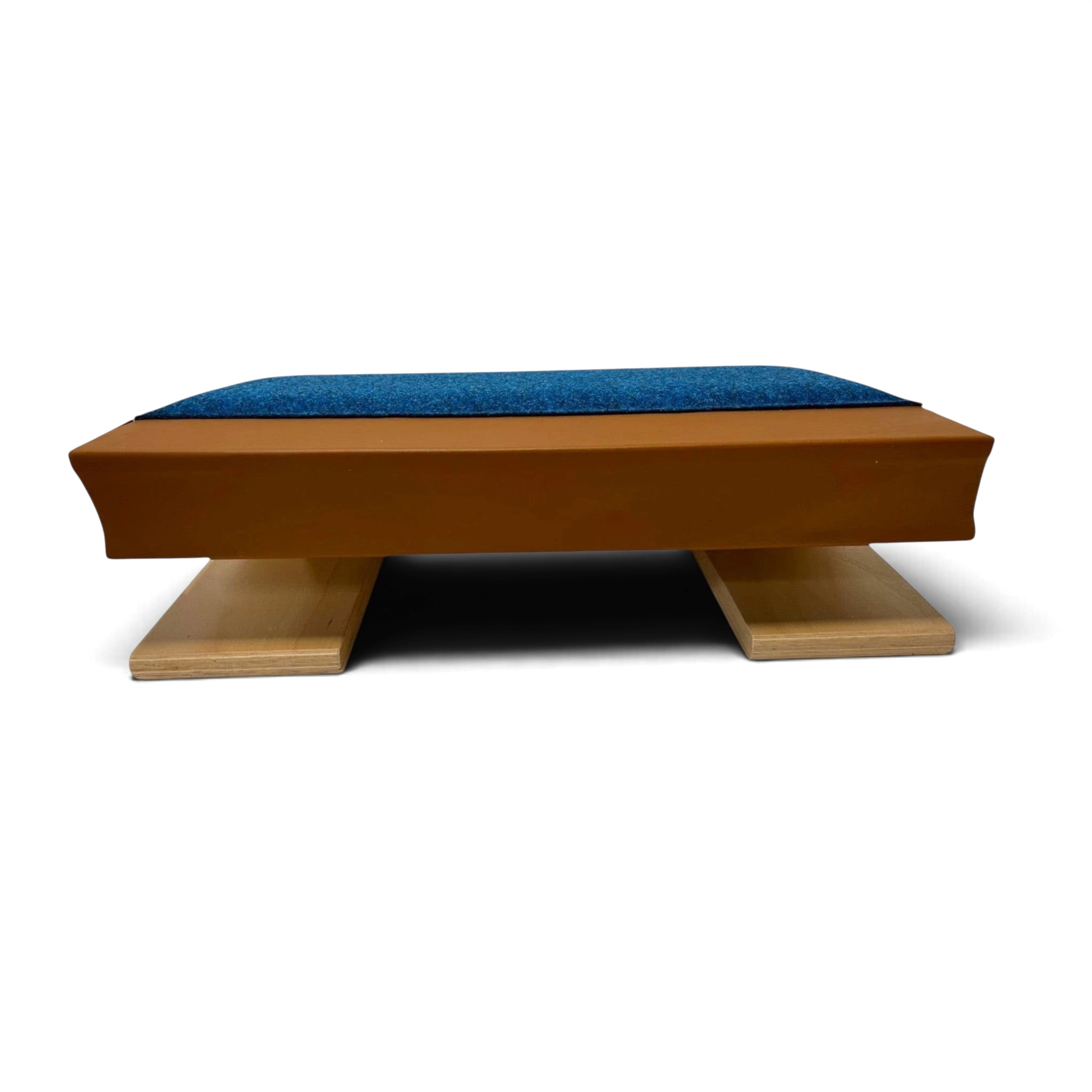 UK Gym Pits Club springboard made of moulded plywood with a blue antimicrobial carpet top for gymnastics training.