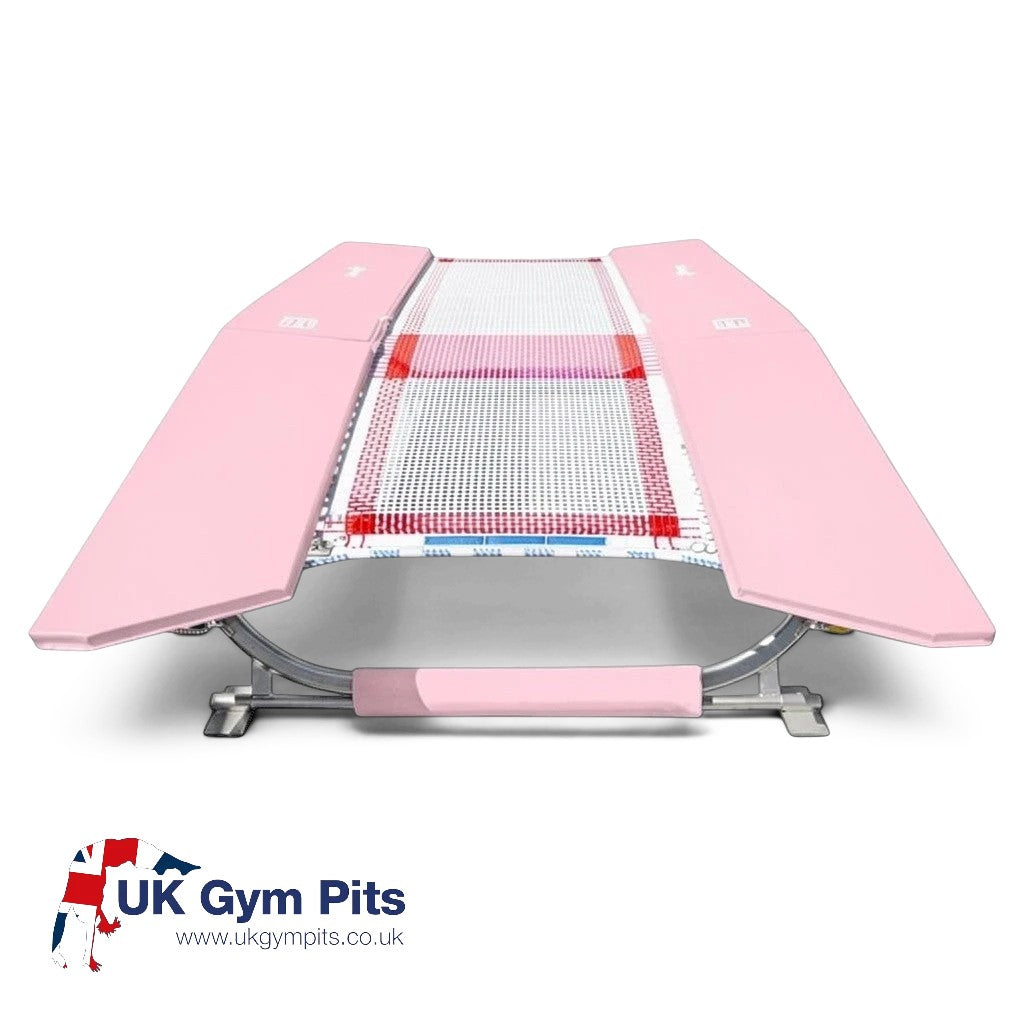 UK Gym Pits double mini trampoline with pink frame pads and white web bed, built to FIG specifications.