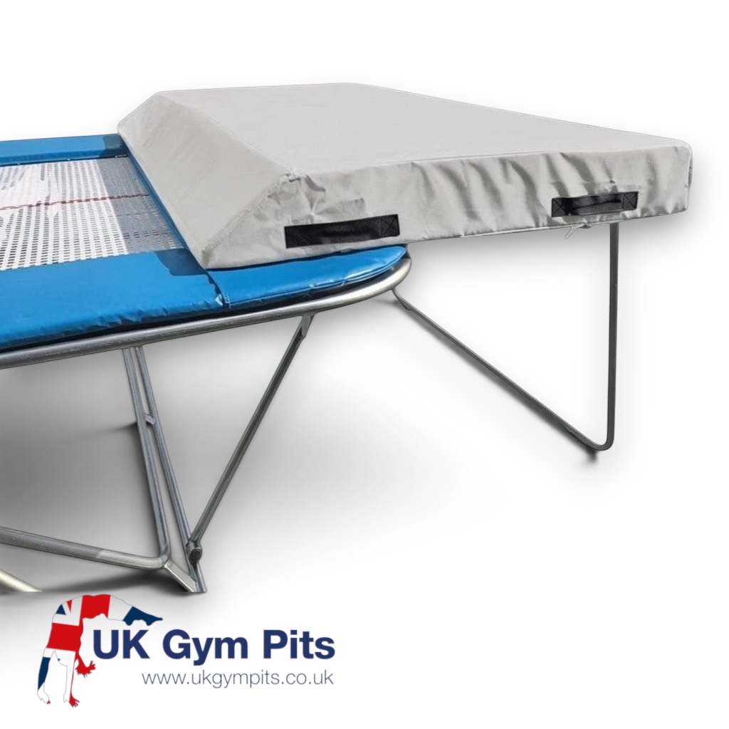 UK Gym Pits economy spotting end deck with grey wedged safety mat attached to a trampoline frame