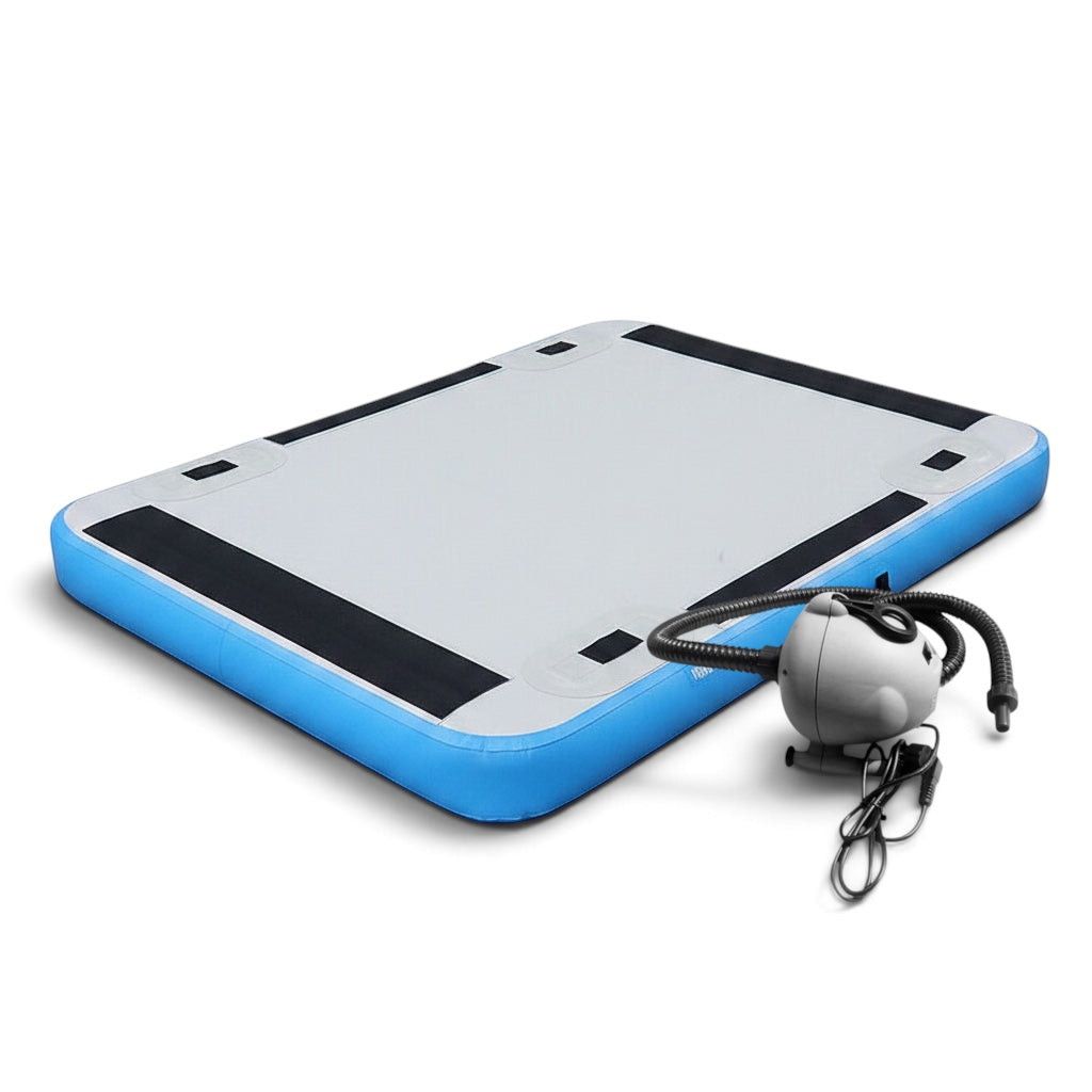 UK Gym Pits electric air pump next to a blue and grey inflatable gymnastics air track mat on a white background.