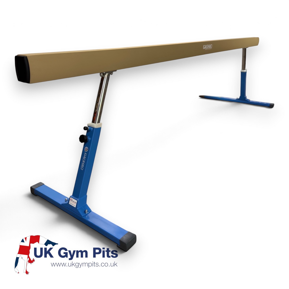 UK Gym Pits FIG approved gymnastics balance beam with tan PU leather surface and adjustable blue steel legs.