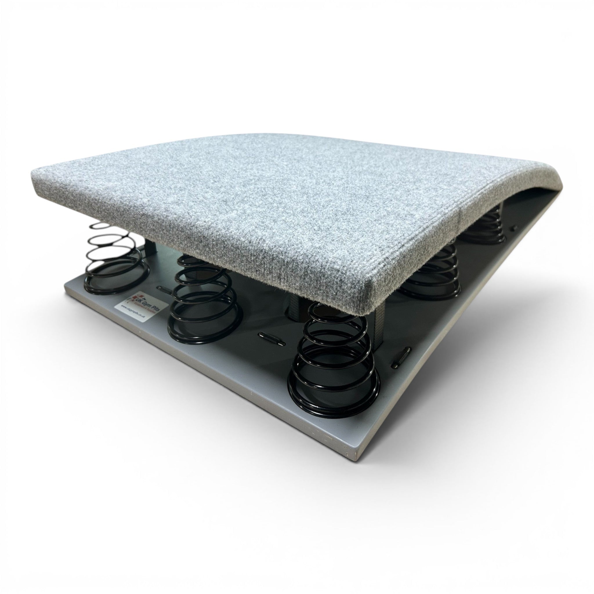 UK Gym Pits FIG approved gymnastics springboard with grey carpeted surface and black tapered springs on plywood base