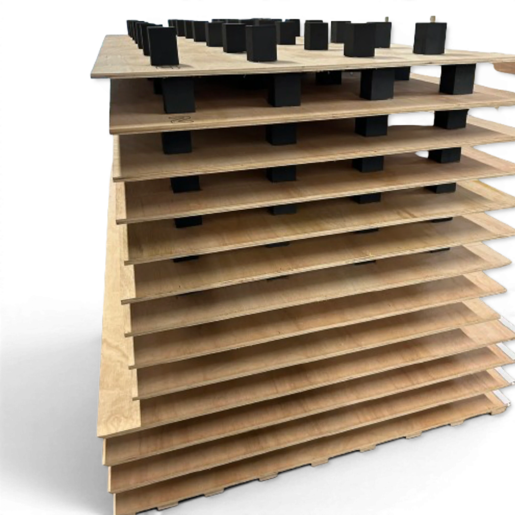 UK Gym Pits high density black foam blocks stacked between layers of plywood for gymnastics sprung floor construction