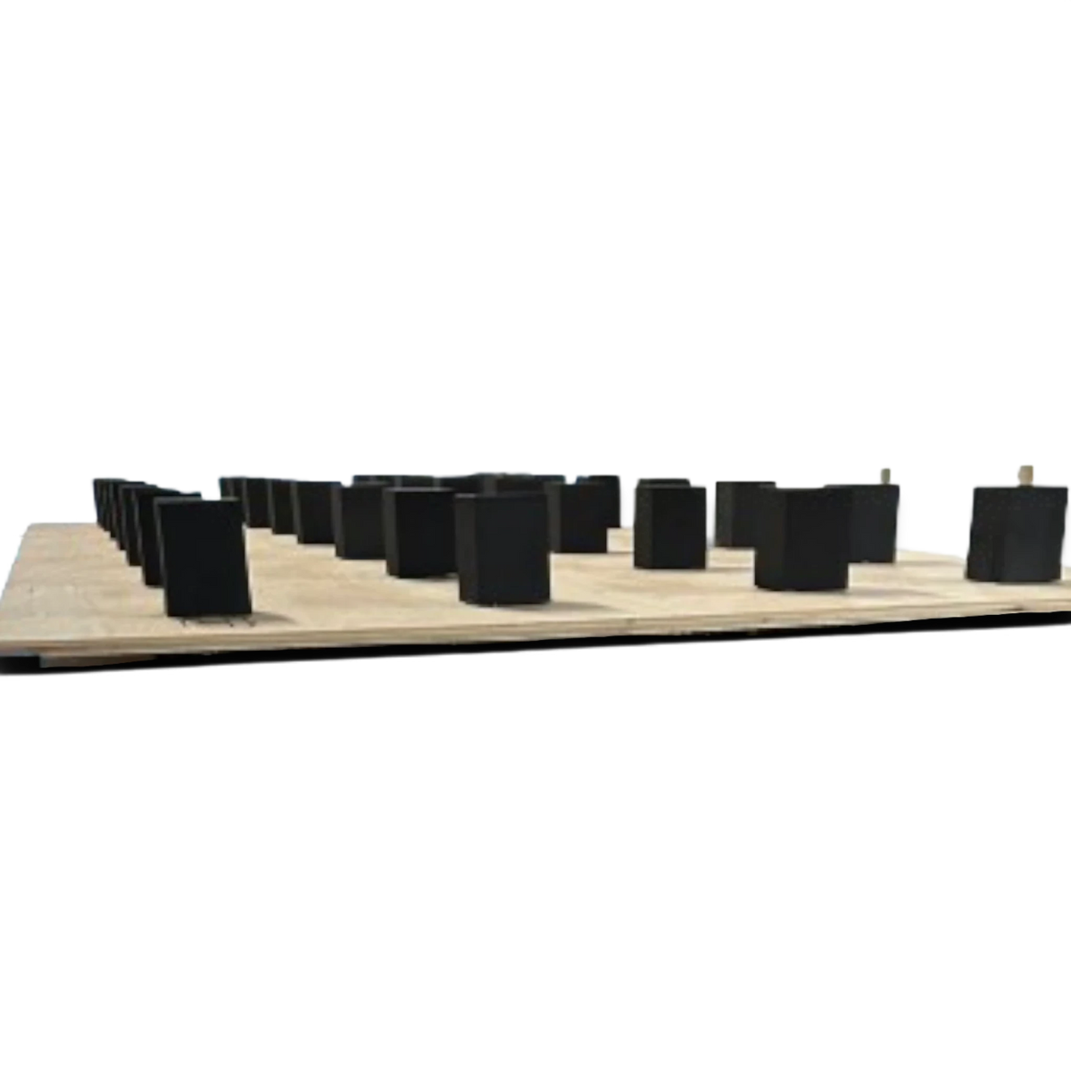 UK Gym Pits black high density PE foam blocks arranged on a plywood base for a gymnastics sprung floor installation.