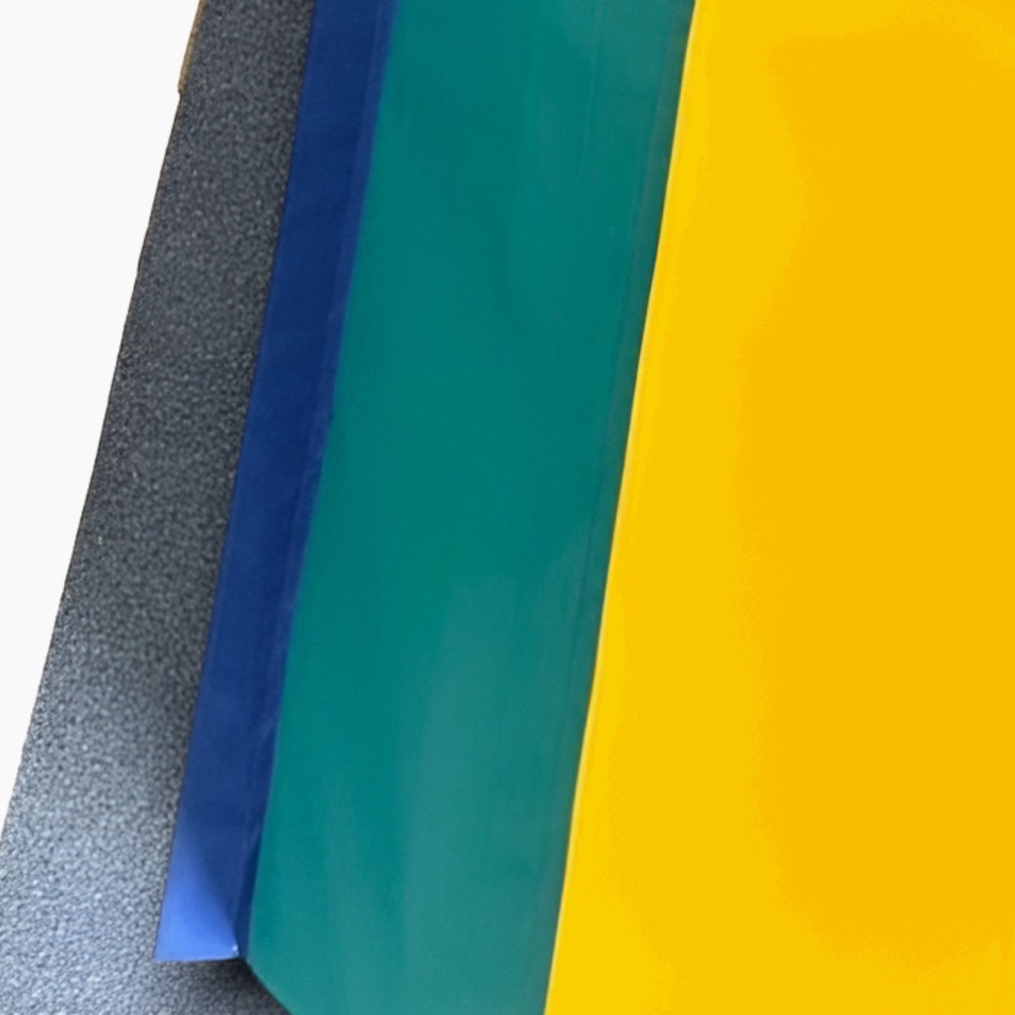 UK Gym Pits 4 tiered foam vault box with yellow, green, and blue PVC sections and a grey anti-slip base