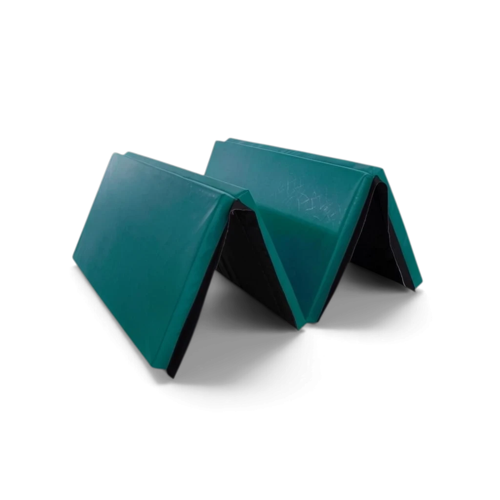 UK Gym Pits foldable green gymnastics mat made of durable PVC and foam, partially folded for easy storage.