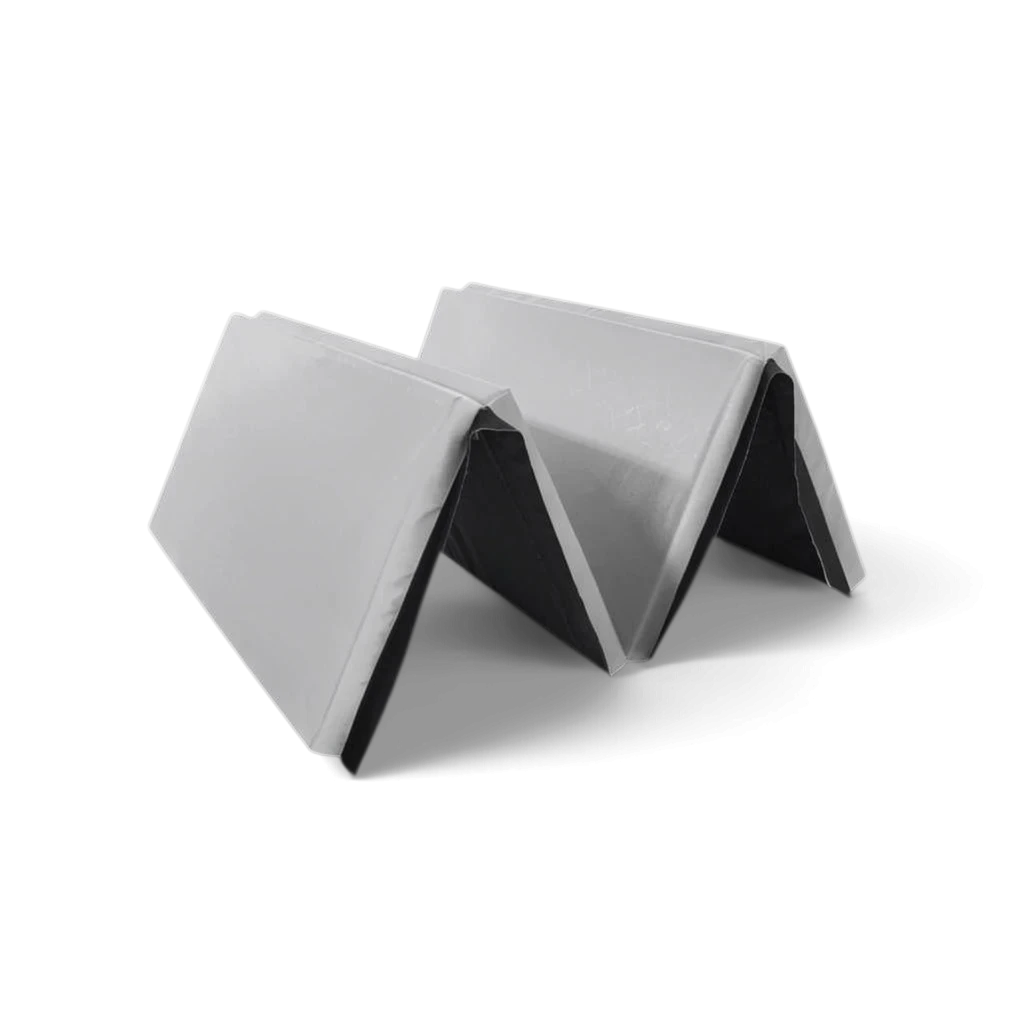 UK Gym Pits foldable grey gymnastics mat made of durable PVC and foam, partially folded for easy storage.