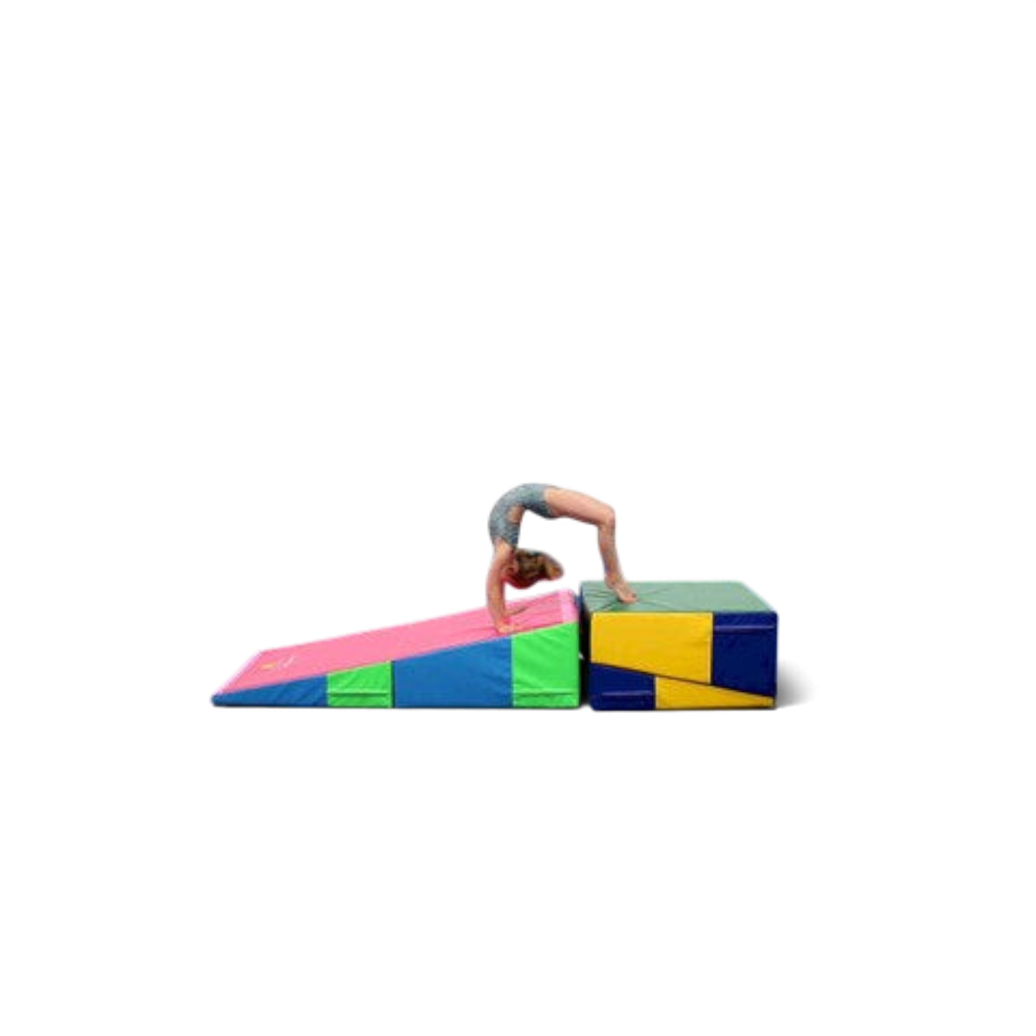 UK Gym Pits folding incline wedge mat used by a gymnast performing a bridge pose on the block and wedge surface