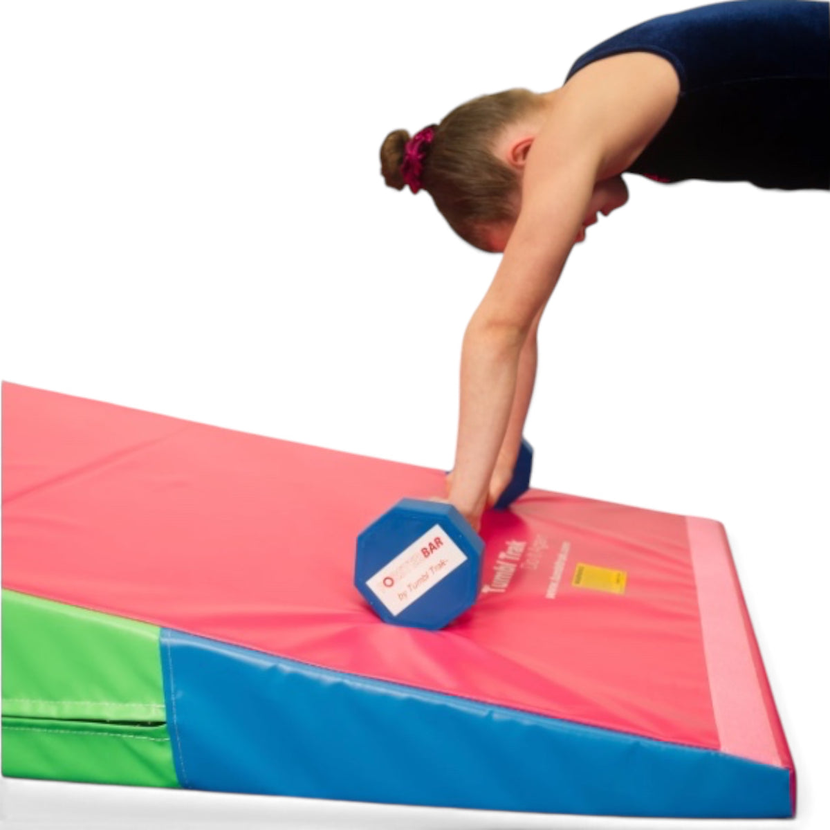 UK Gym Pits Forster Bar training aid with blue octagonal ends being used by a gymnast on a red and green wedge mat