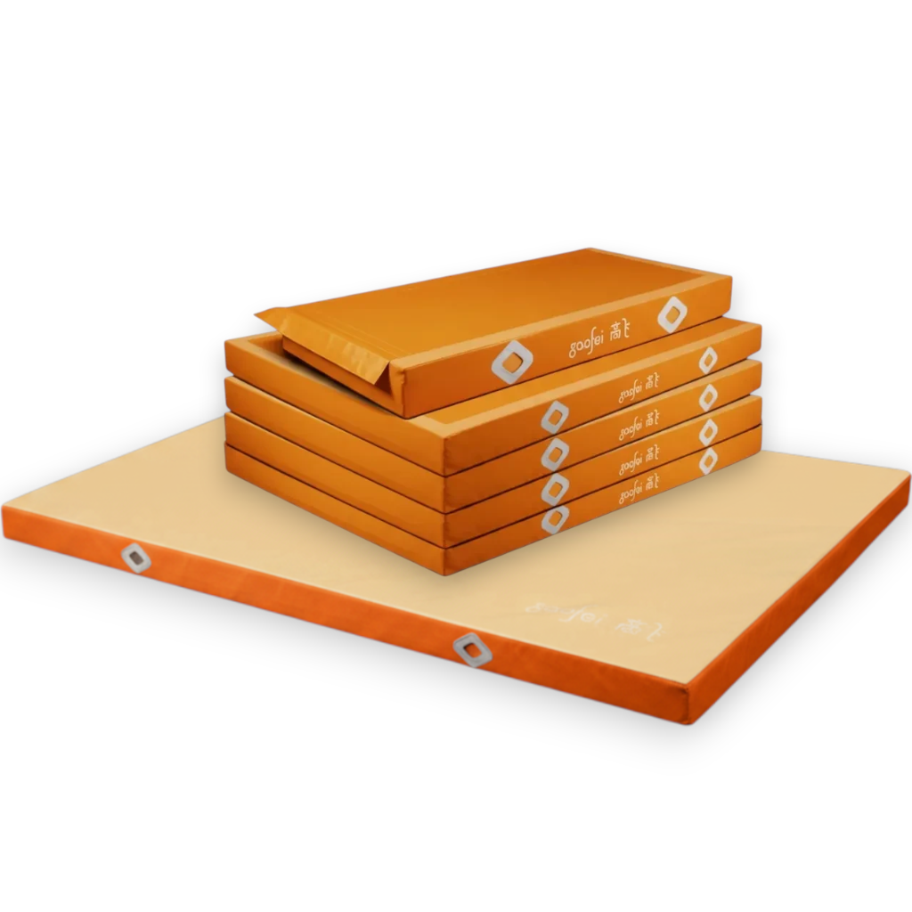 UK Gym Pits Gaofei asymmetric bars landing mats in orange with a soft topper mat for gymnastics training.
