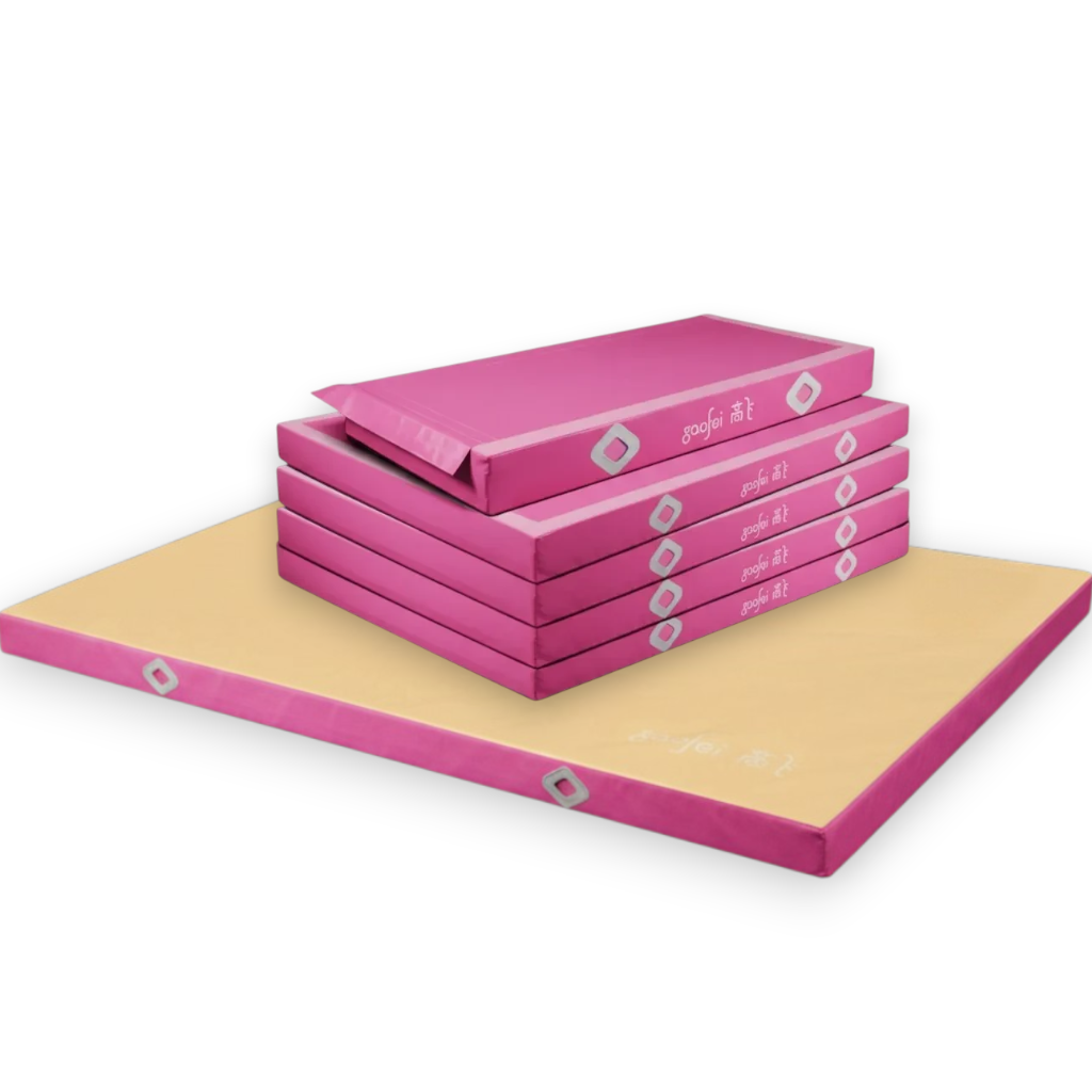 UK Gym Pits Gaofei FIG approved asymmetric bars landing mats in pink and beige with durable PVC vinyl and air mesh.
