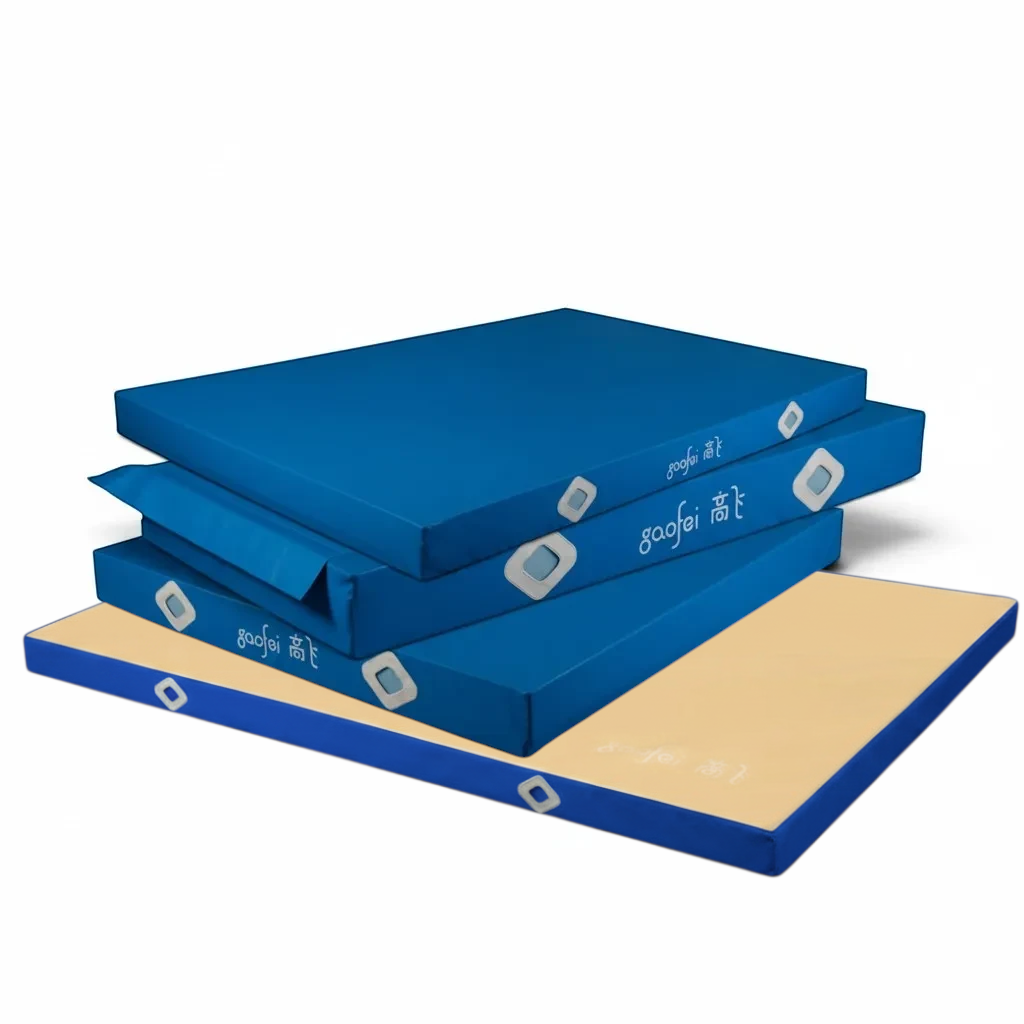 UK Gym Pits Gaofei blue and beige gymnastics landing mats with air distribution mesh windows for safe training.