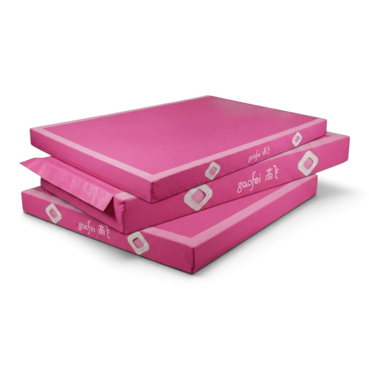 UK Gym Pits Gaofei pink FIG approved gymnastics beam landing mats stacked for training and competition use.