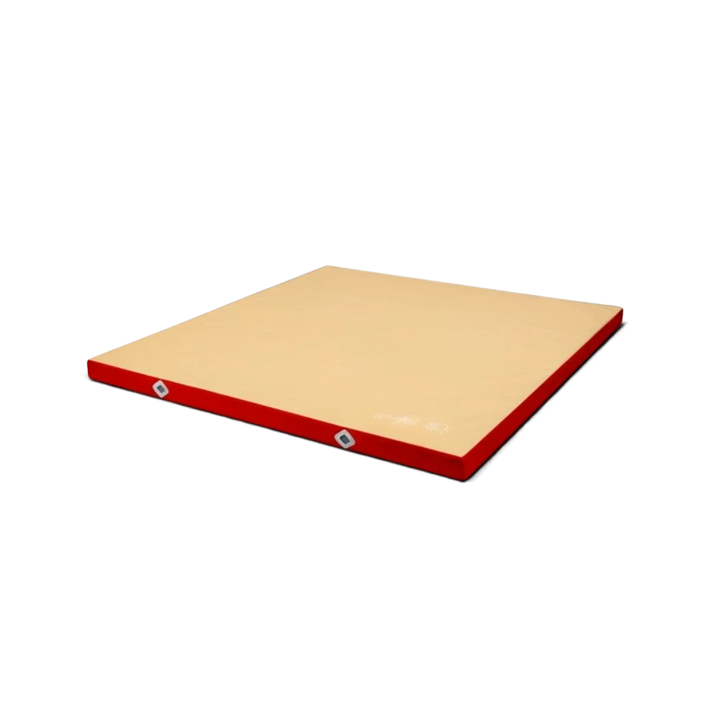 UK Gym Pits FIG approved soft topper landing mat with a beige jersey fabric top and red PVC sides for gymnastics.