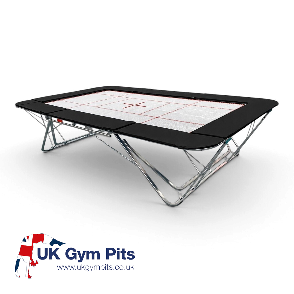UK Gym Pits GM Extreme competition trampoline with a white 4mm by 6mm web bed and black protective frame pads.