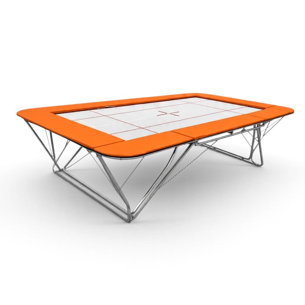 UK Gym Pits GM Extreme competition trampoline with a white 6mm web bed and orange frame pads on a white background