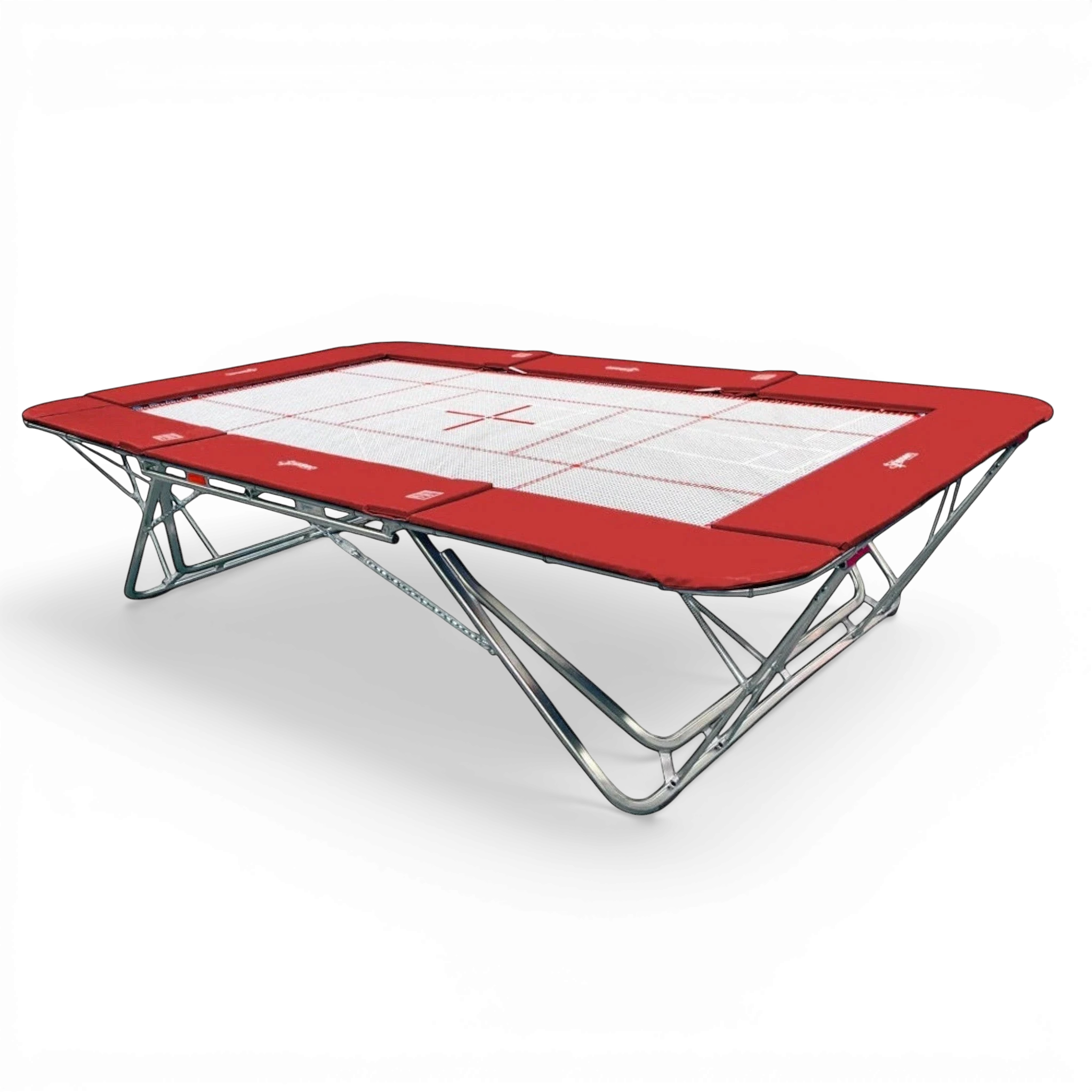 UK Gym Pits GM Extreme competition trampoline with a 13mm web bed and red protective frame pads on a black background.