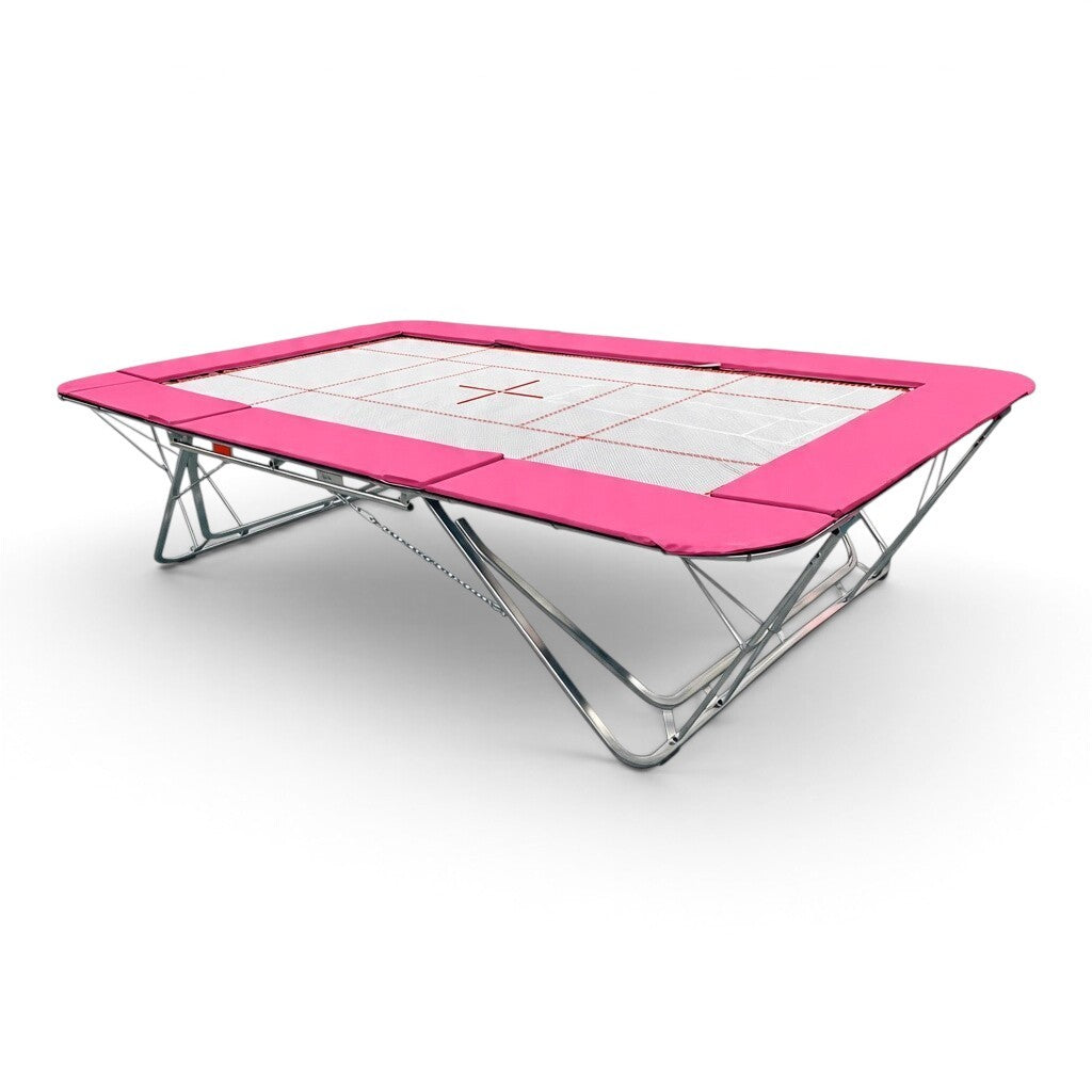 UK Gym Pits GMEX Extreme competition trampoline with a white web bed and vibrant pink protective frame pads.