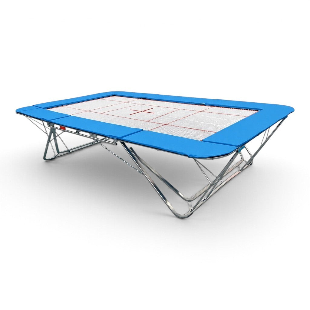 UK Gym Pits GMEX Extreme competition trampoline with blue frame pads and a white web bed on a steel frame