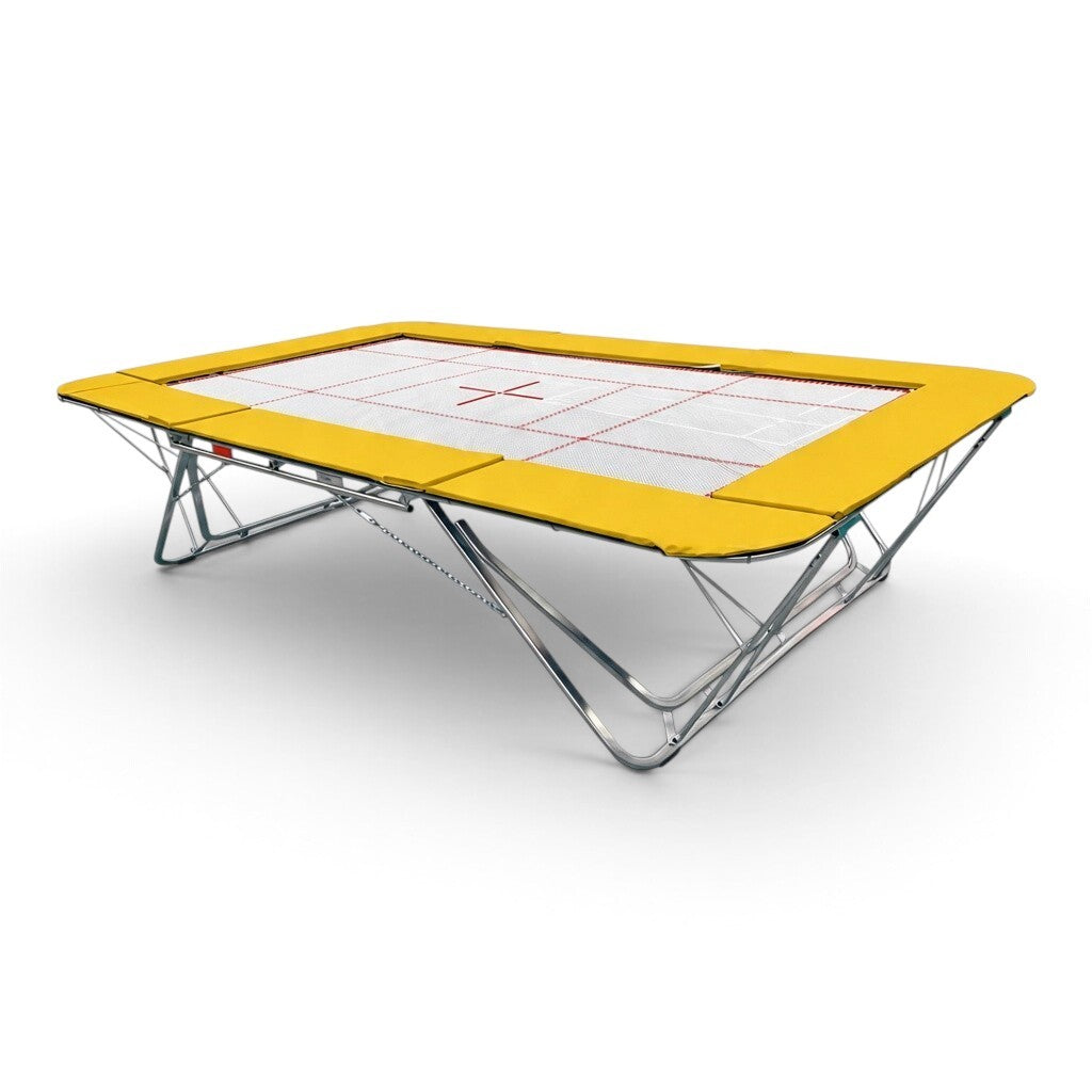 UK Gym Pits GMEX Extreme competition trampoline with a white web bed and yellow protective frame pads