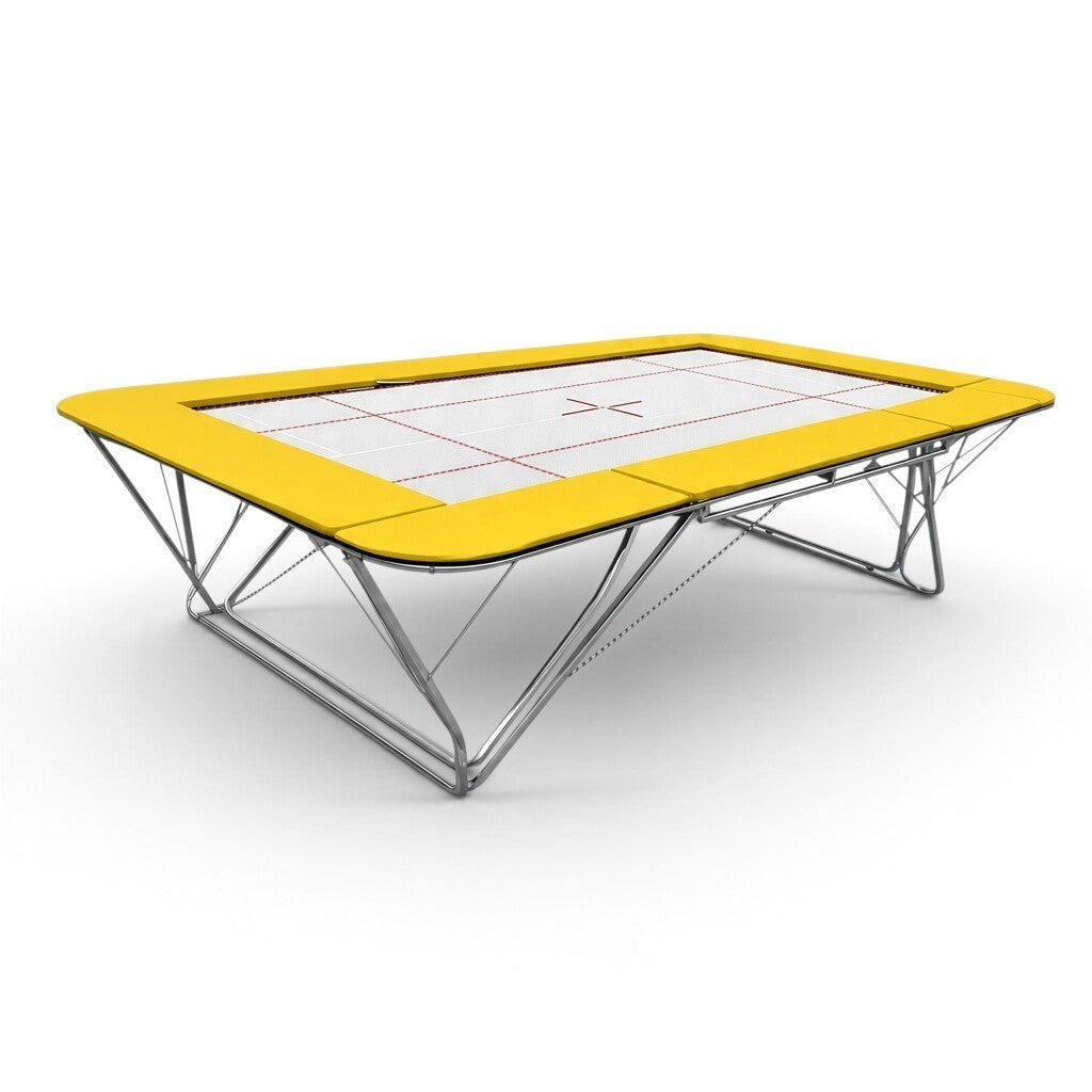 UK Gym Pits GMEX Extreme competition trampoline with a white web bed and bright yellow protective frame pads.