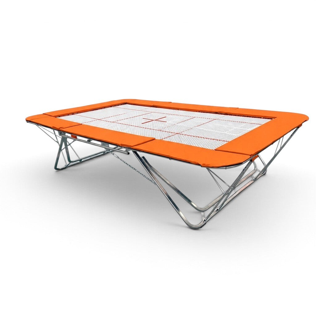 UK Gym Pits GMEX Extreme competition trampoline with orange frame pads and a white web bed on a white background