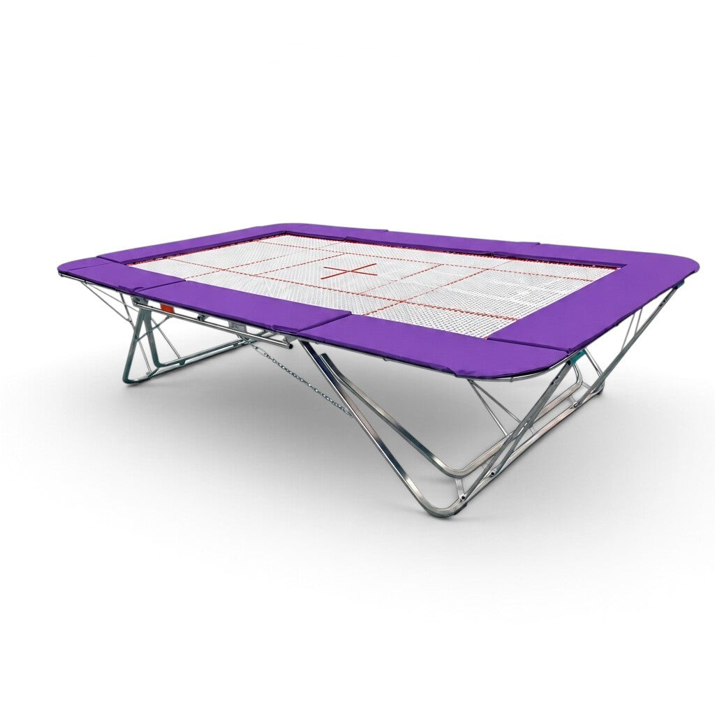 UK Gym Pits GMEX Extreme competition trampoline with a white web bed and purple protective frame pads