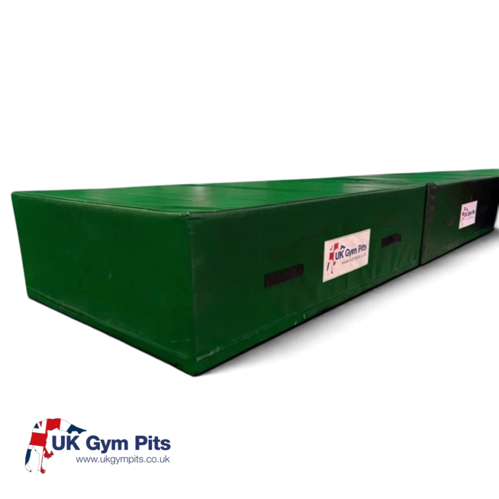 UK Gym Pits green high-density foam track run-up block with heavy-duty PVC cover and side handles for gymnastics