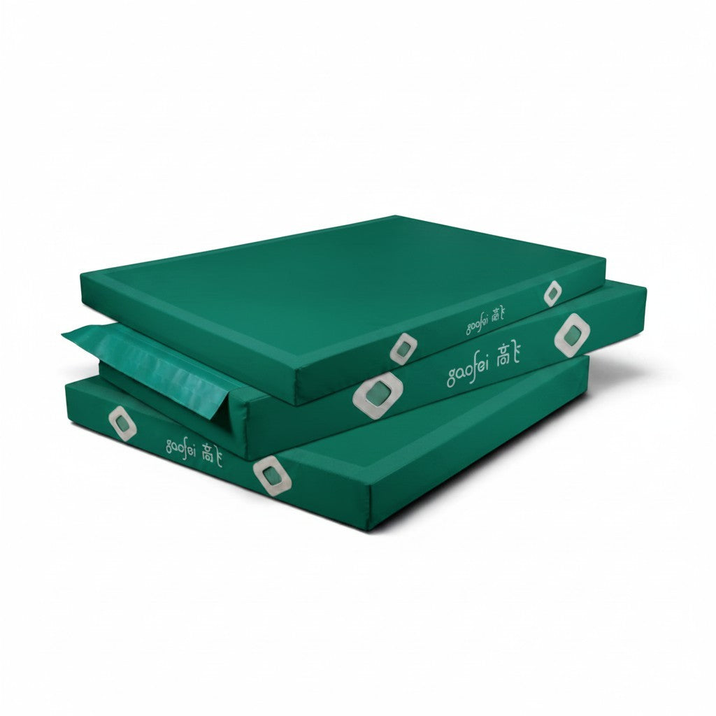 UK Gym Pits Gaofei green gymnastics landing mats with reinforced corners and air mesh windows for safe training.