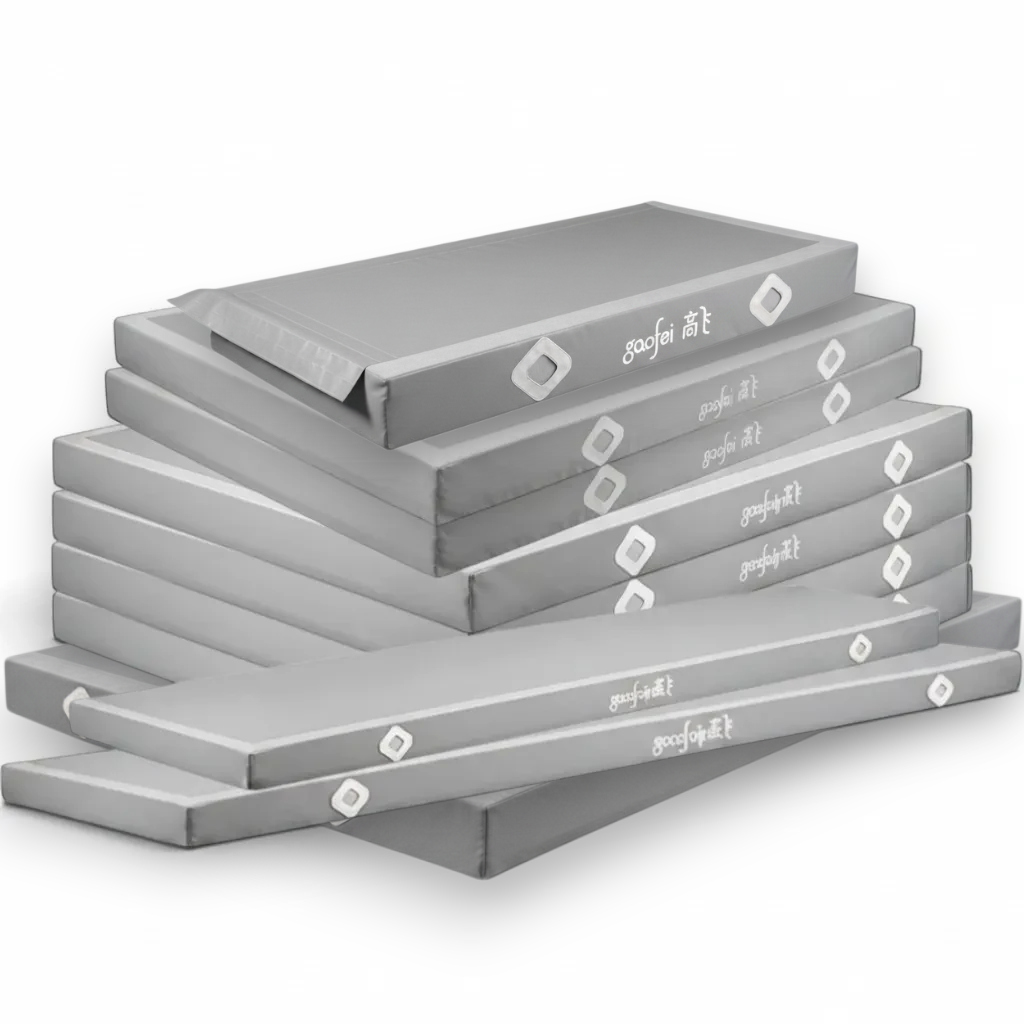 UK Gym Pits FIG approved grey parallel bars landing mats stacked for training and competition use