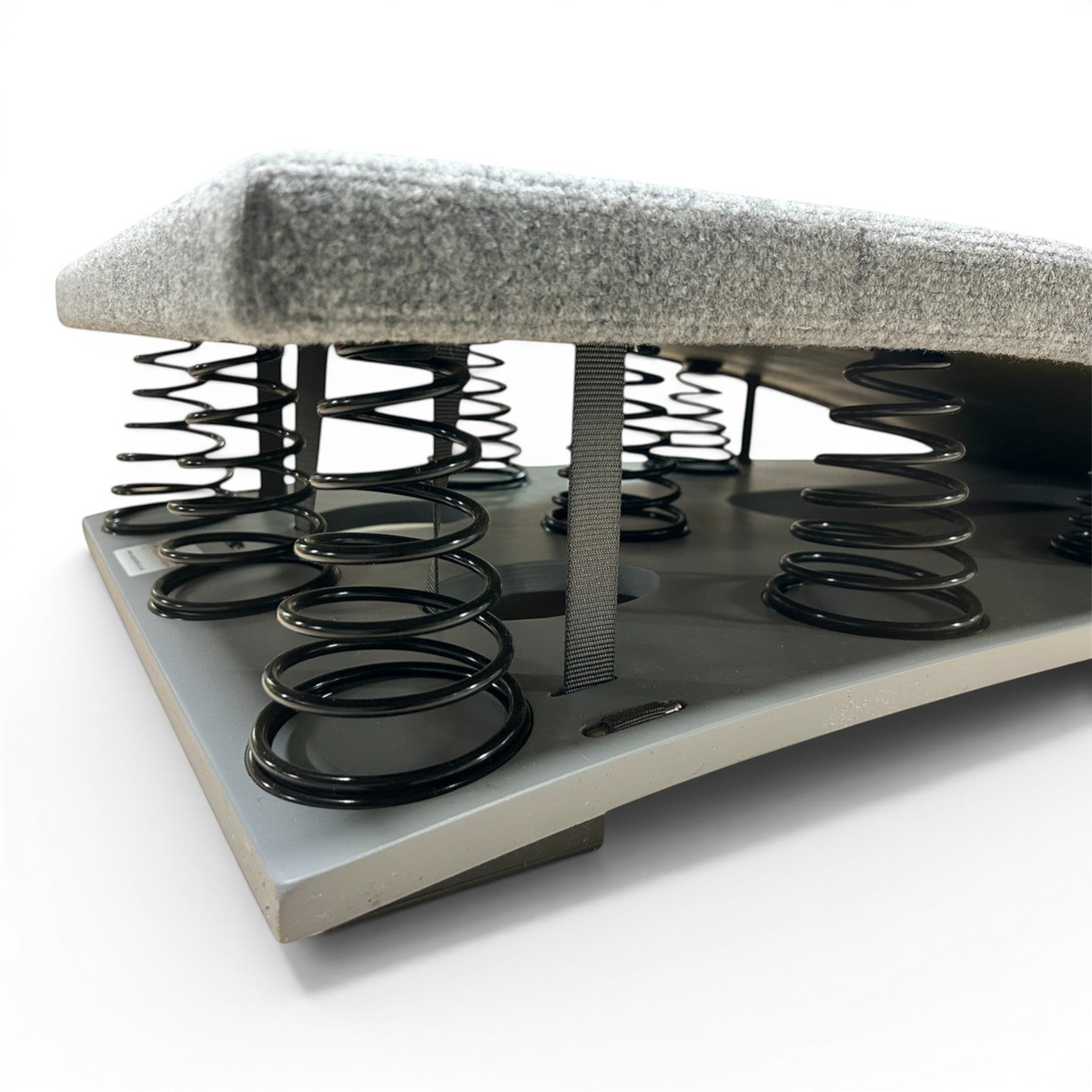 UK Gym Pits FIG approved gymnastics springboard with grey carpeted surface and black tapered steel springs
