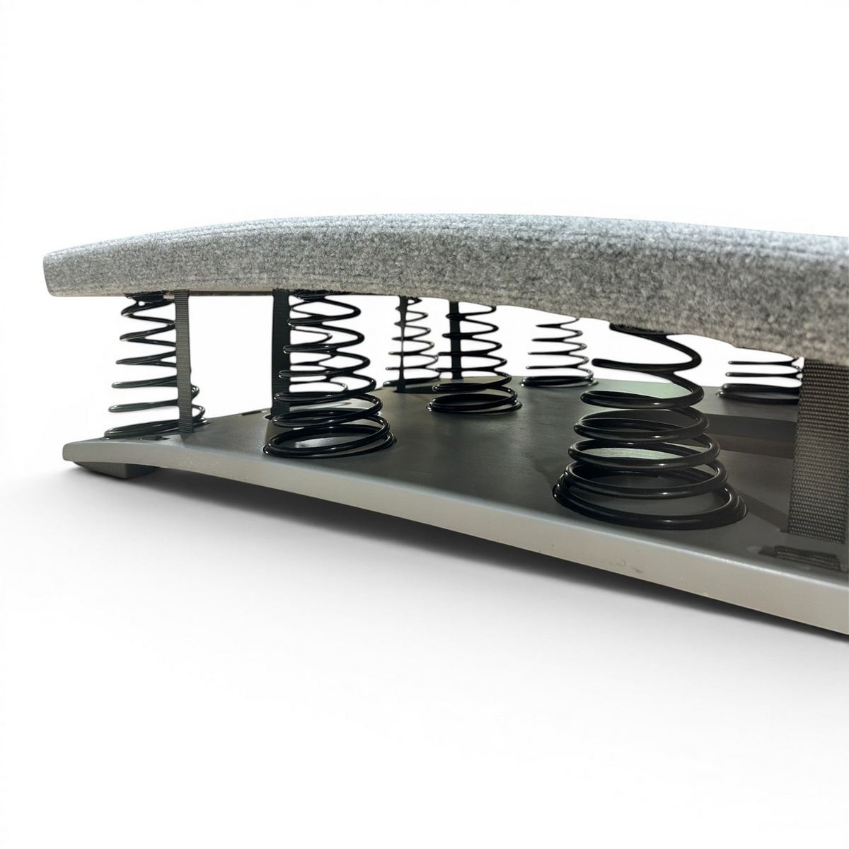 UK Gym Pits FIG approved gymnastics springboard featuring a grey carpeted surface and high-performance tapered springs