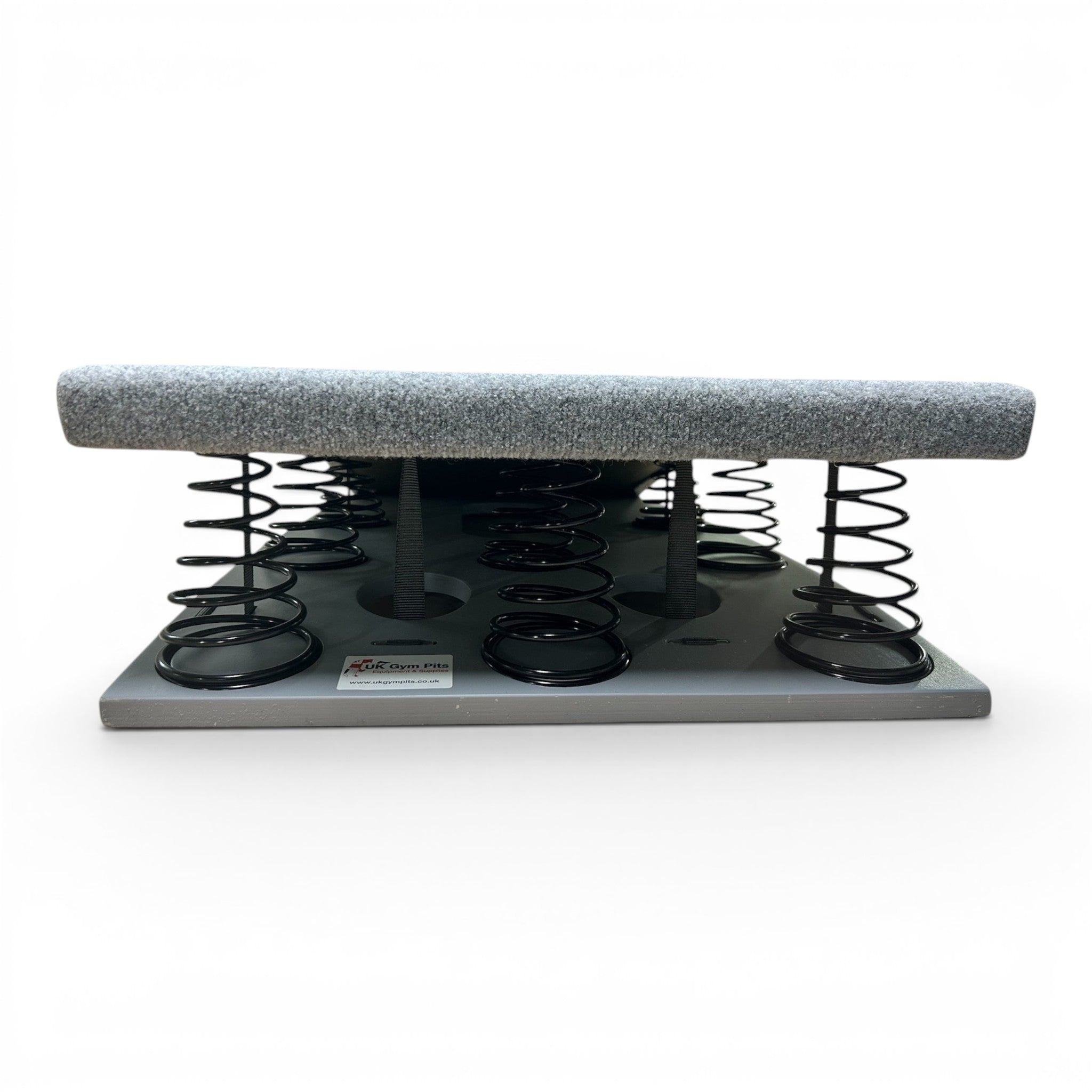 UK Gym Pits FIG approved gymnastics springboard with grey carpeted surface and high-density tapered steel springs