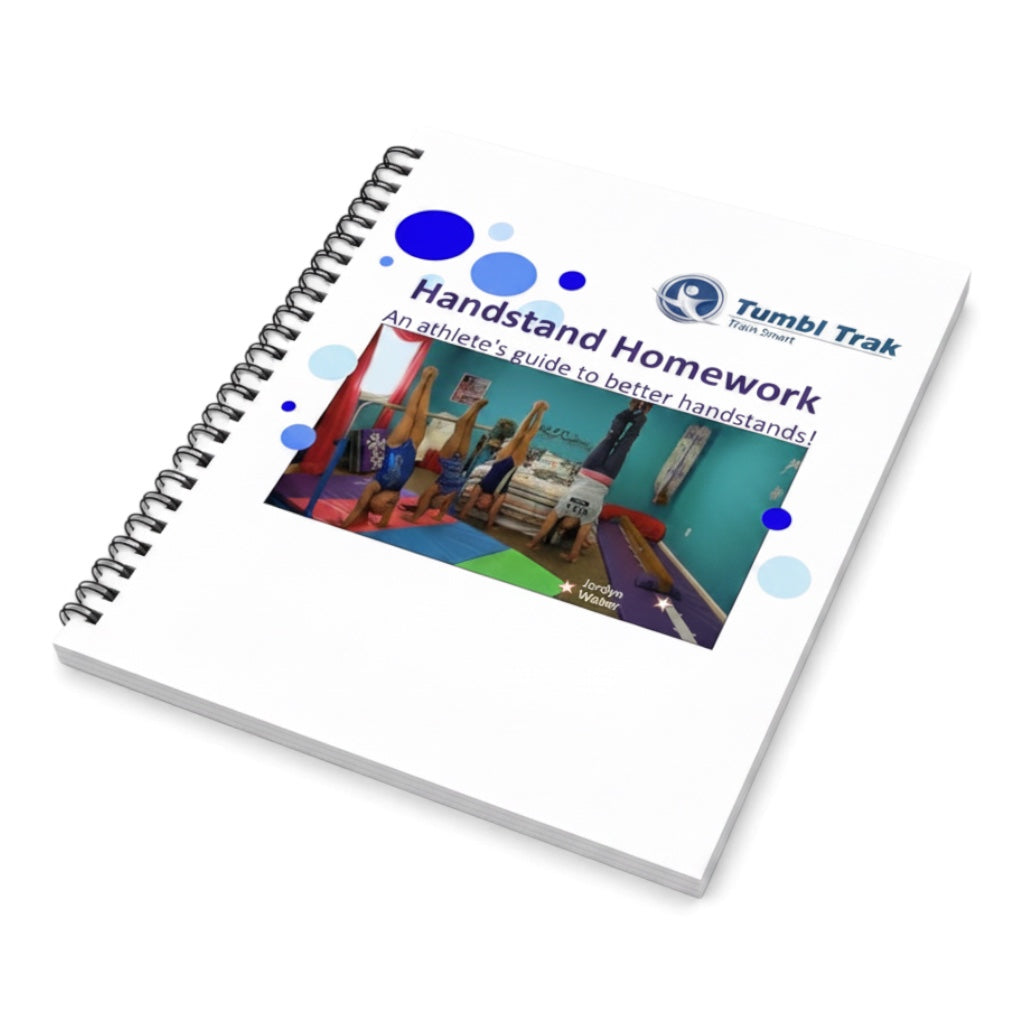UK Gym Pits Handstand Homework spiral-bound workbook for gymnasts featuring instructional photos and activities.