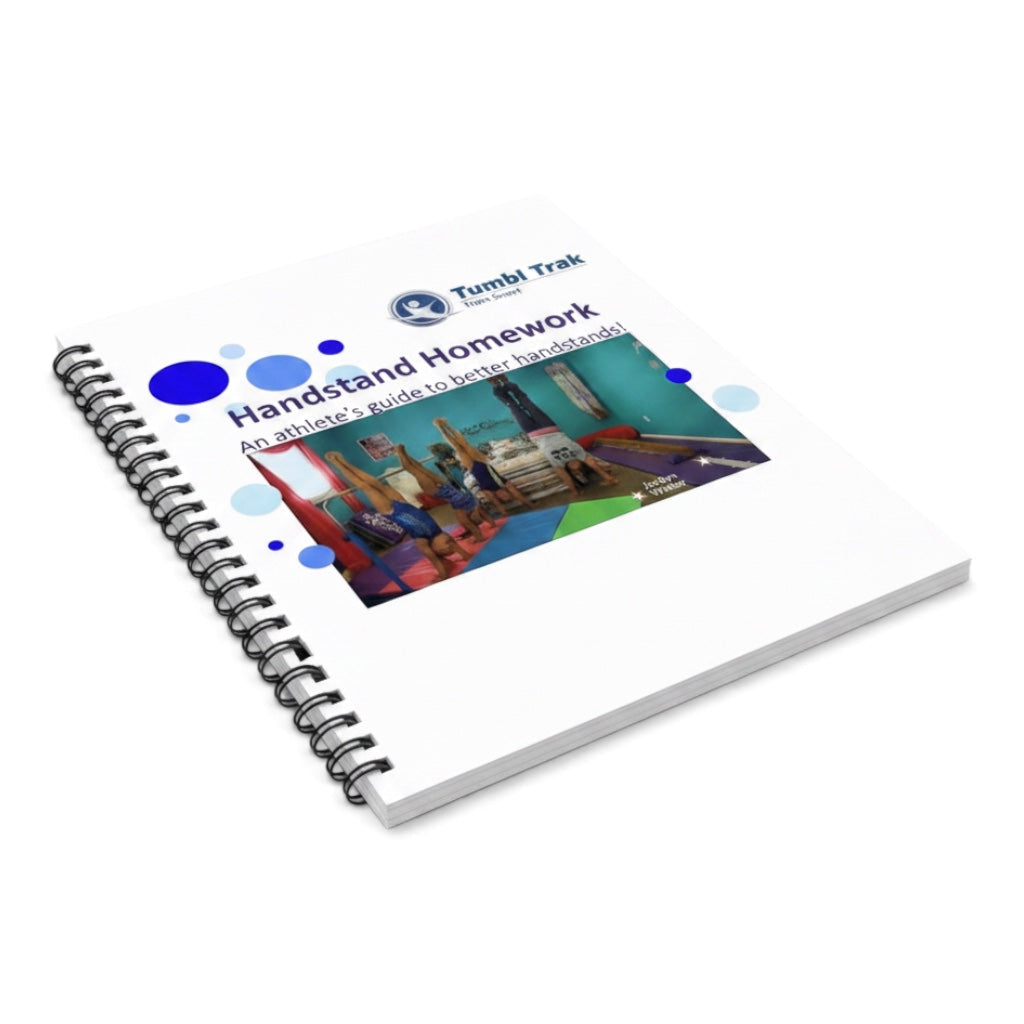 UK Gym Pits Handstand Homework spiral-bound workbook for young gymnasts featuring instructional handstand photos.