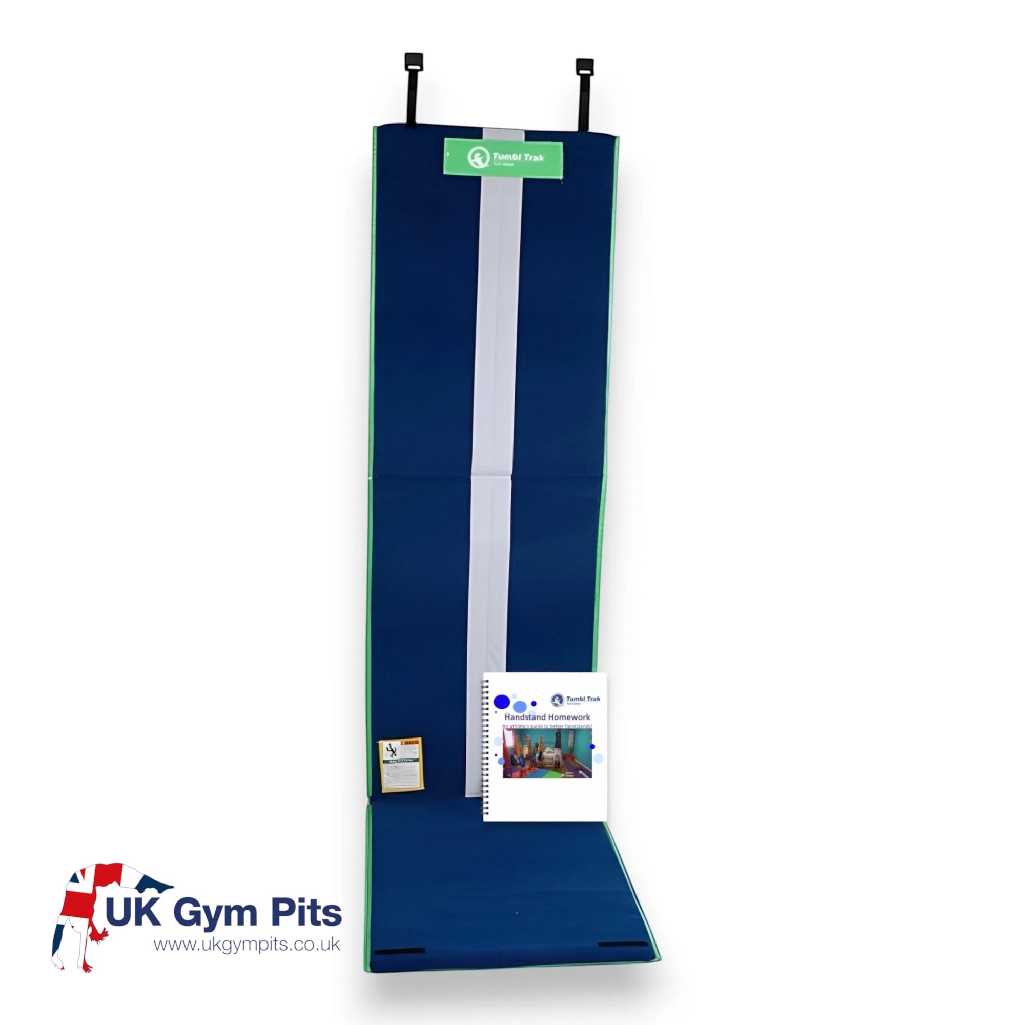 UK Gym Pits Handstand Homework mat with blue carpet surface, white center line, and instructional workbook included.
