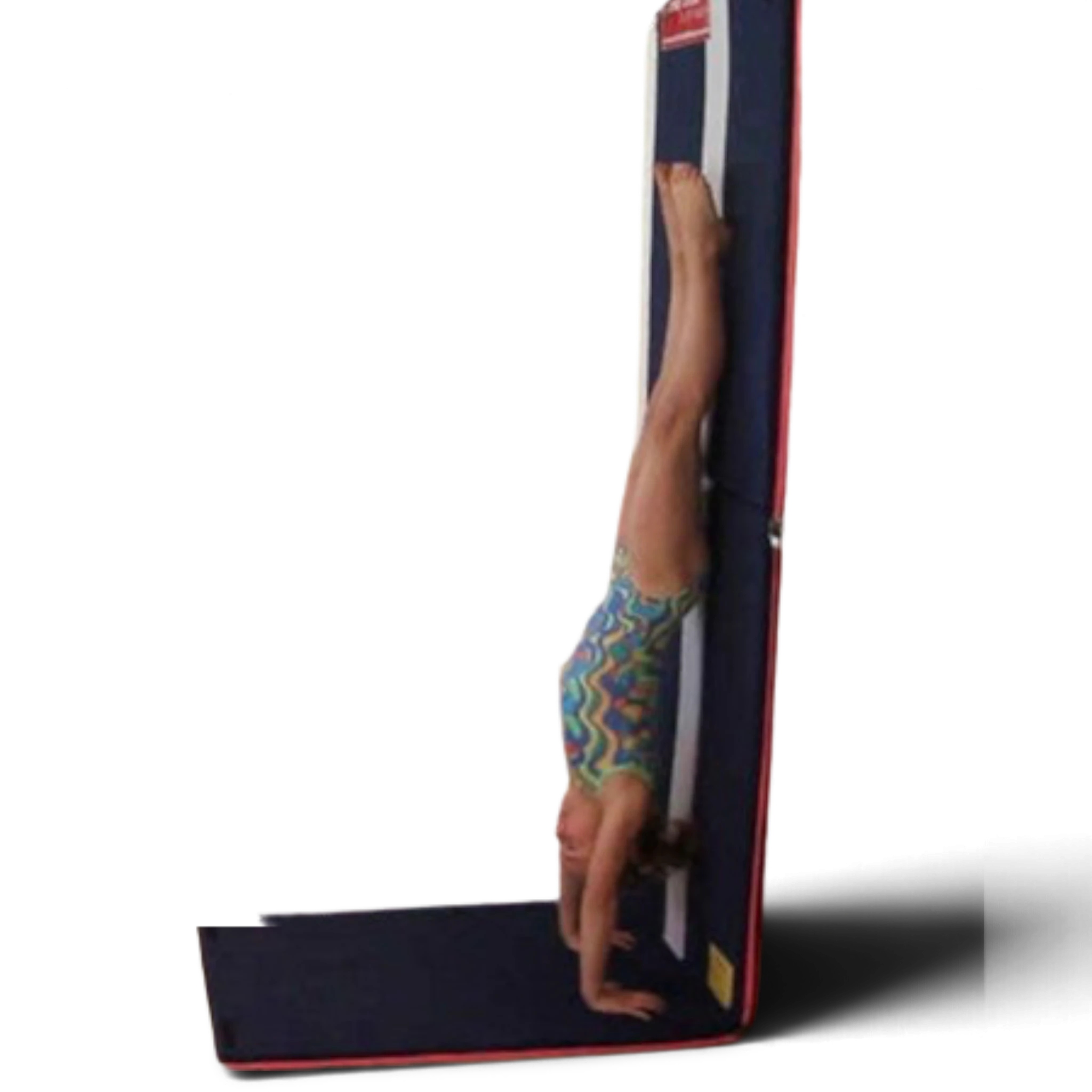 Gymnast performing a handstand on a UK Gym Pits reversible training mat mounted to a wall