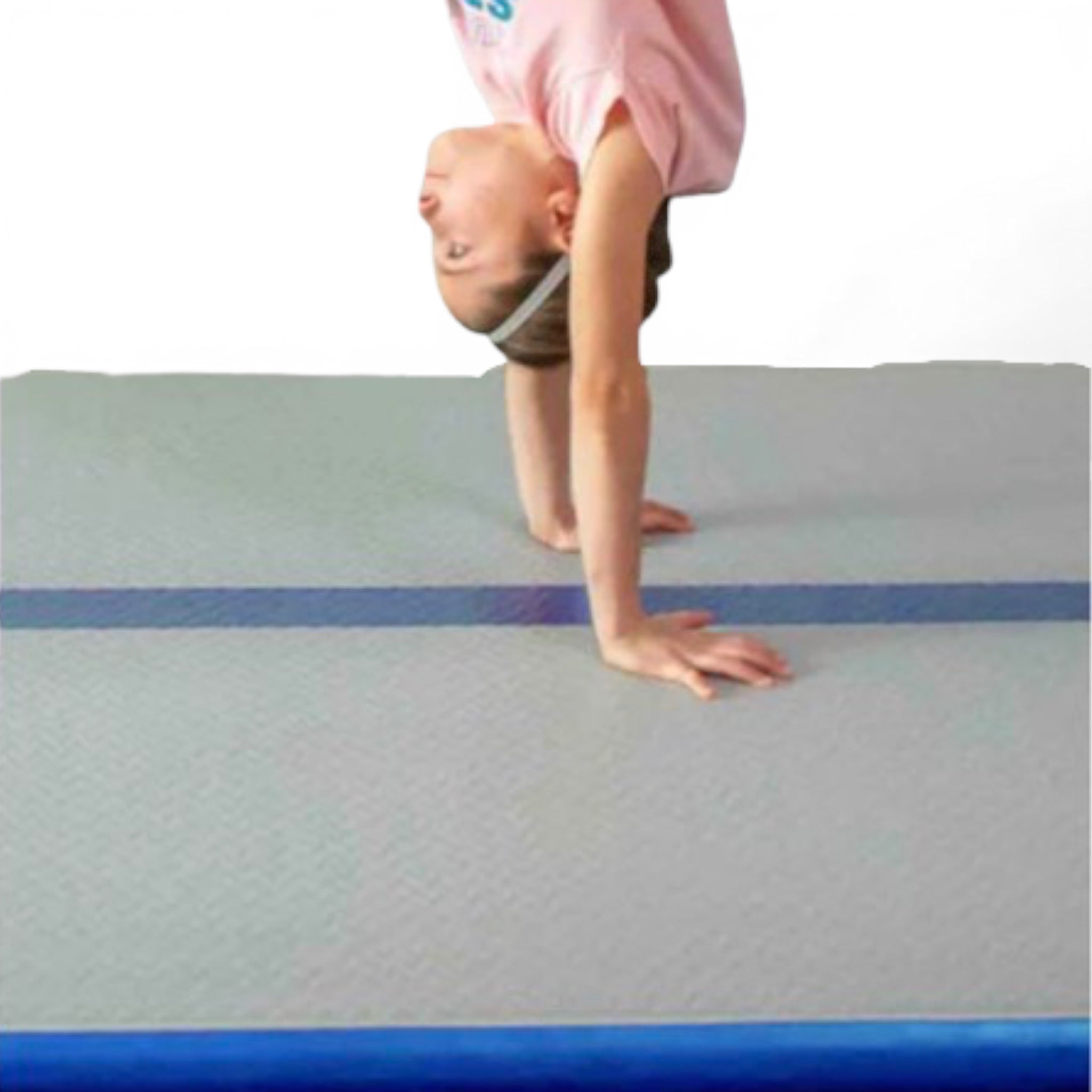 UK Gym Pits home air floor with a gymnast performing a handstand on the blue centre beam line