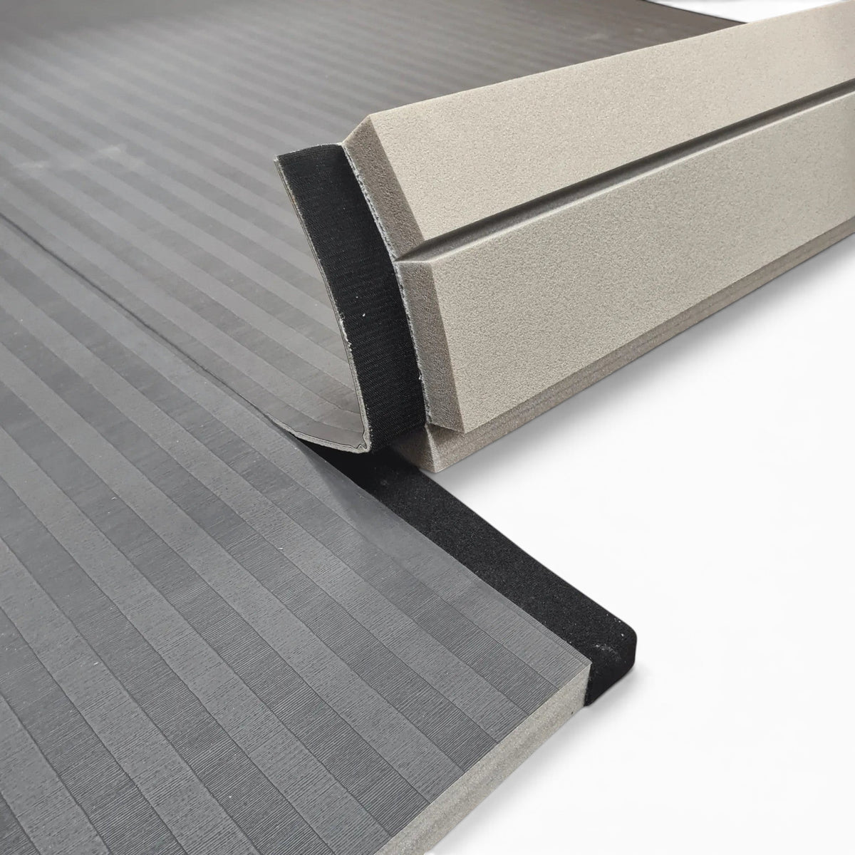 UK Gym Pits Hybrid Connect mat roll featuring a black tatami PVC surface and Velcro flap for seamless connection.