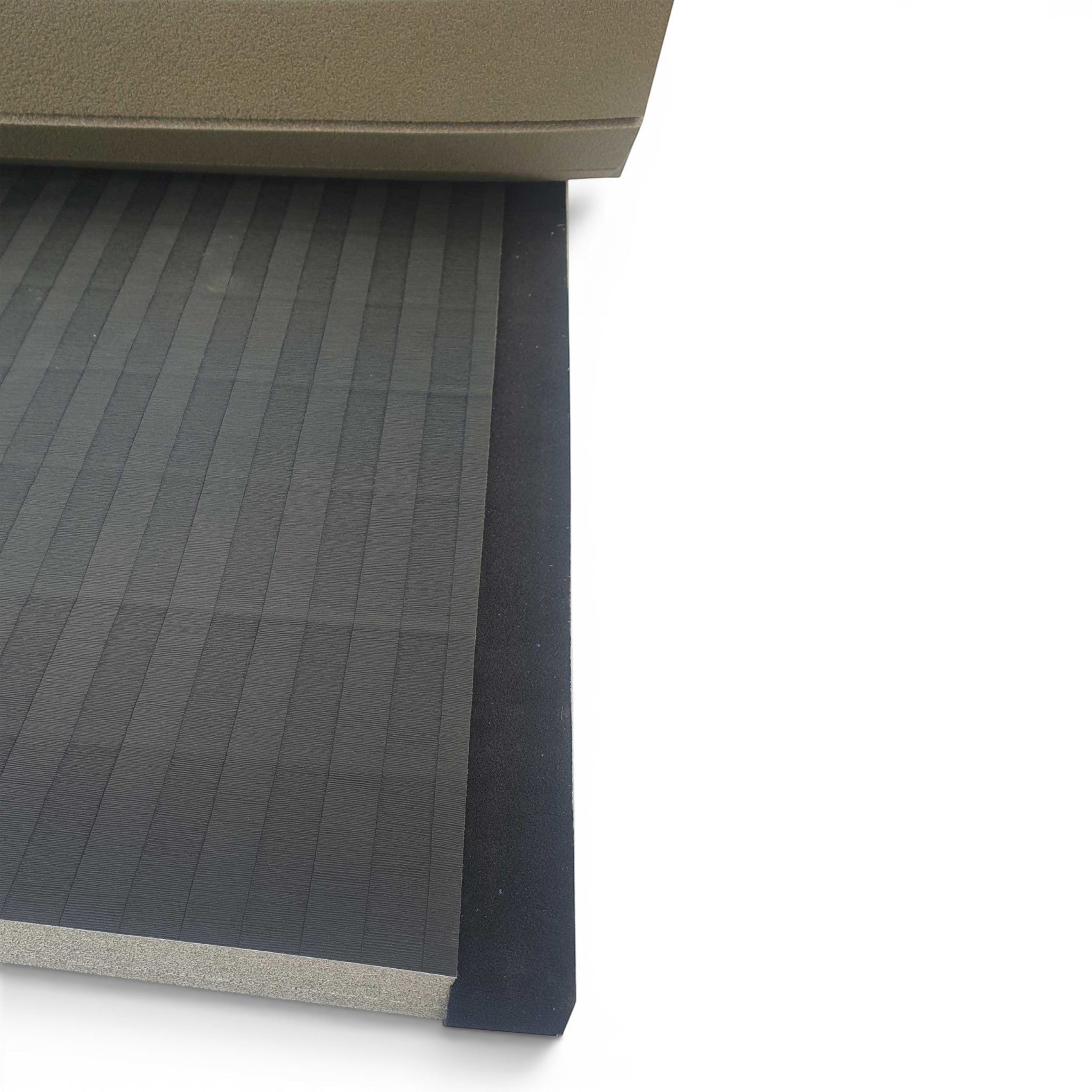 UK Gym Pits black Hybrid Connect mat roll featuring a durable tatami-textured PVC surface and shock-absorbing XPE foam.