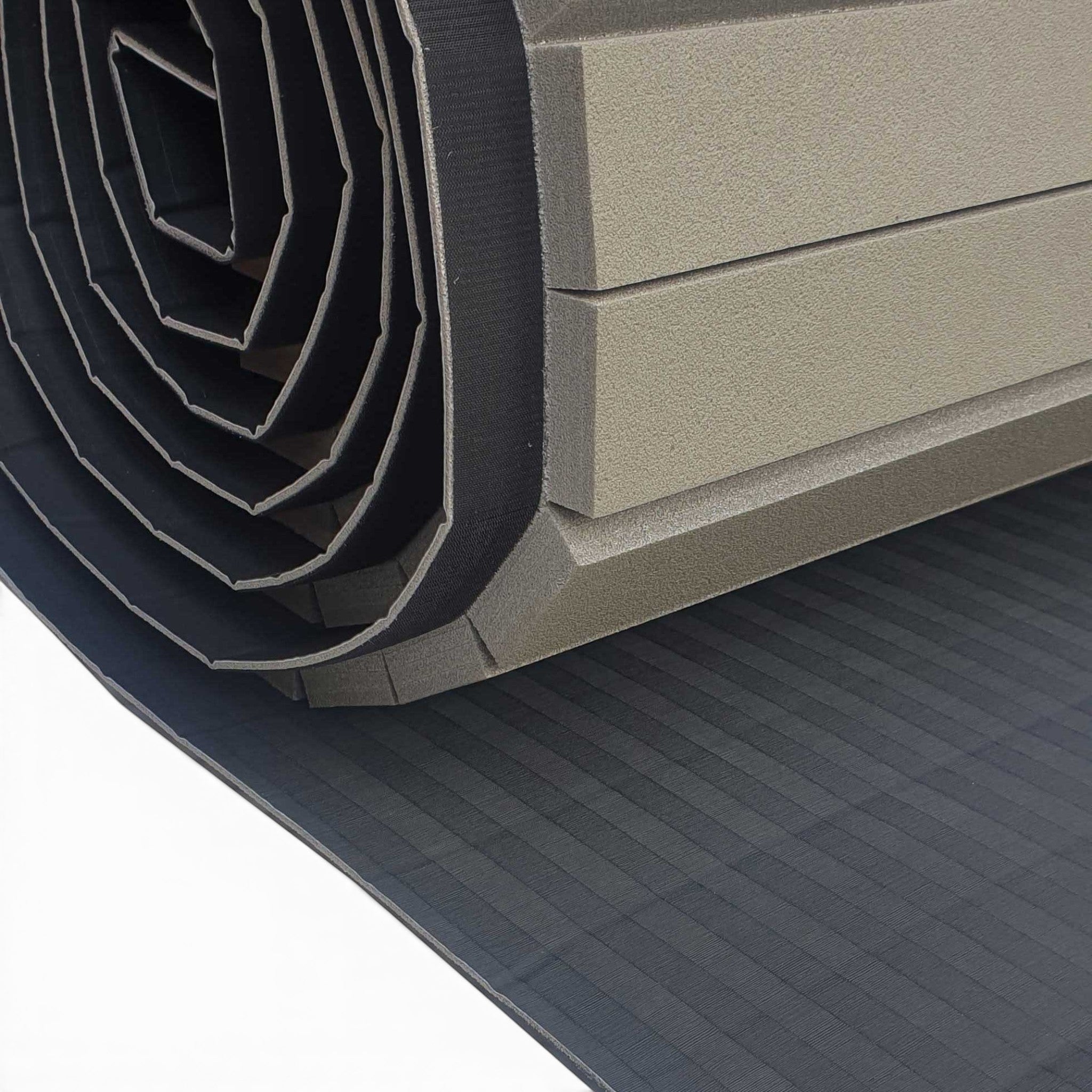 UK Gym Pits Hybrid Connect mat roll featuring a durable black tatami PVC surface and shock-absorbing XPE foam core.