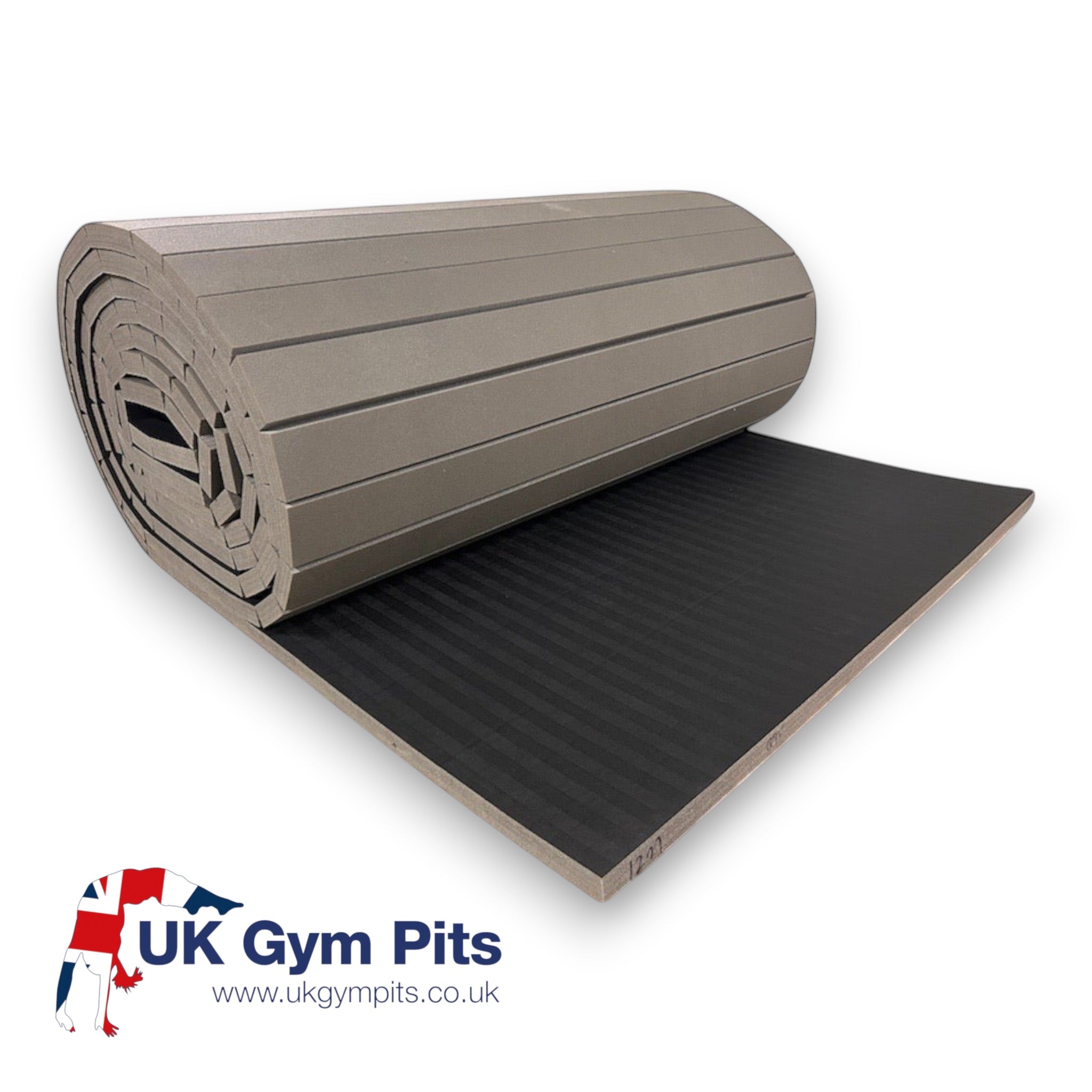 UK Gym Pits hybrid gymnastics mat roll in grey with a black tatami-textured PVC surface and shock-absorbing XPE foam.